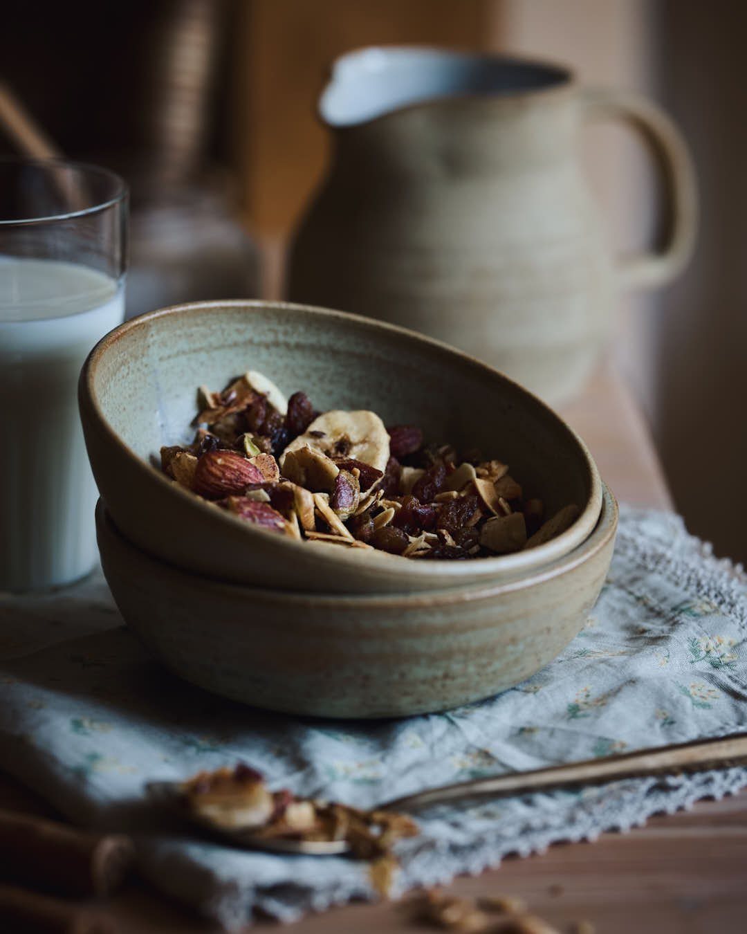 granola in bowl showing texture and banana chips in farmhouse setting
