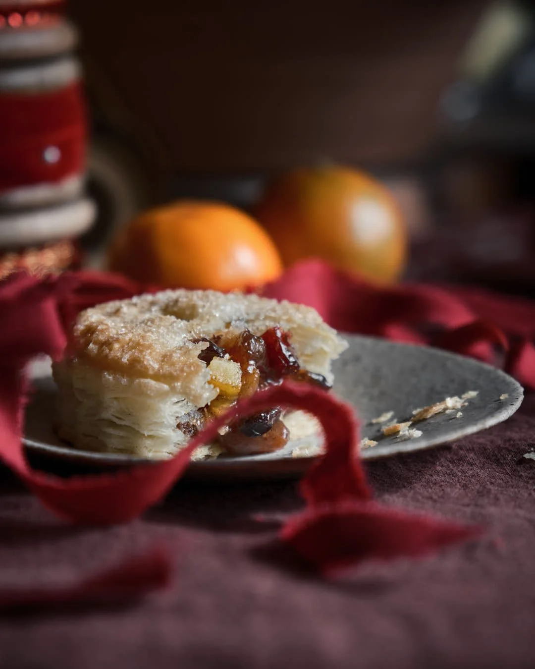 macro image of mince pie with ribbon in front