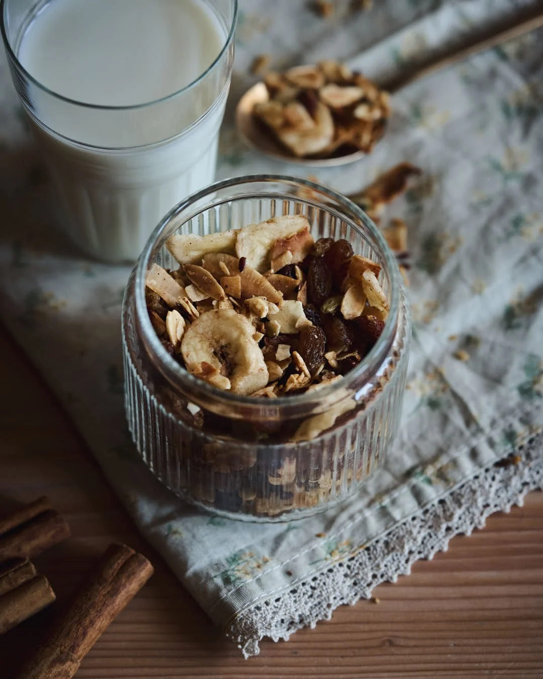 angled overhead image of granola in jar showing banana chips and texture