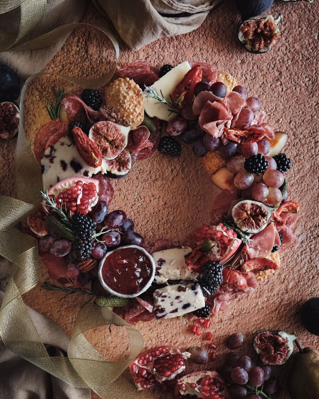 angled image of charcuterie wreath on stunning metallic backdrop