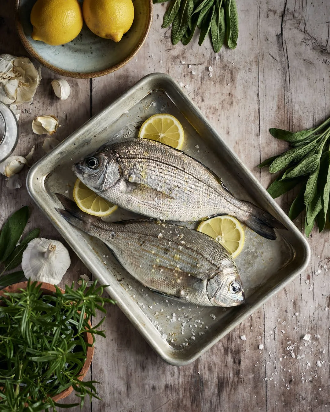 flatlay image of fish on metal tray