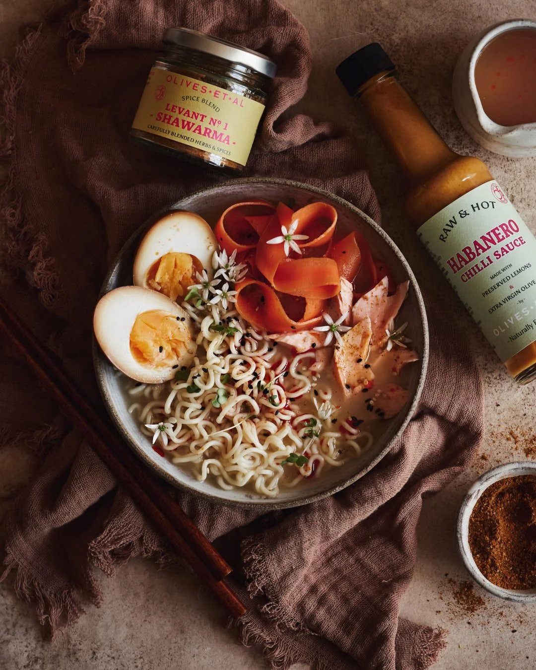 latlay image of ramen noodles with eggs in rustic scene