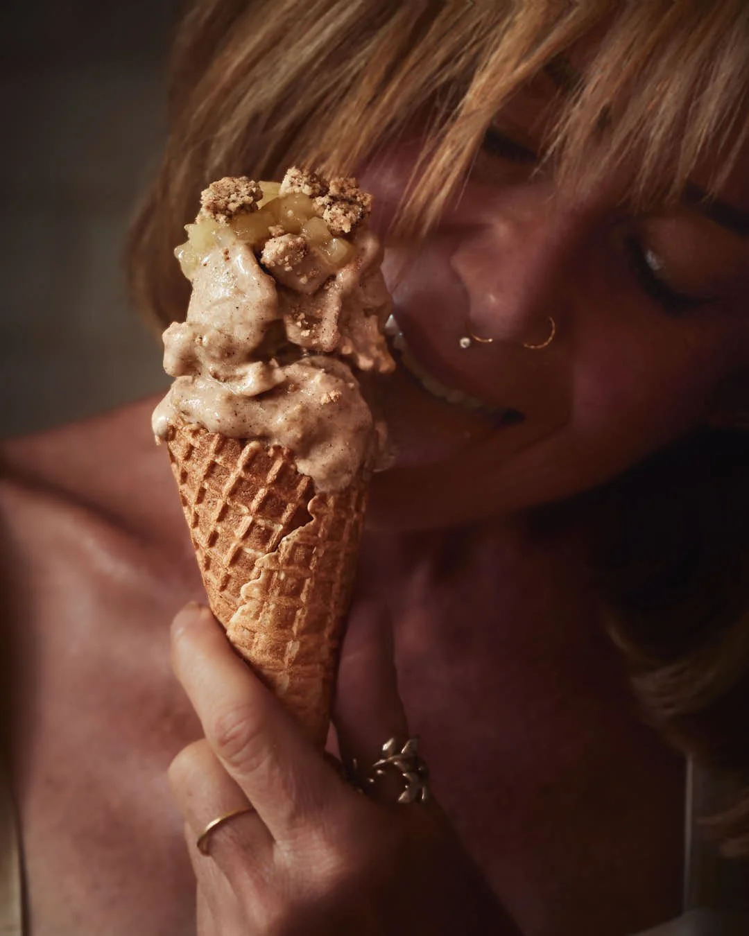macro image of girl eating ice cream in soft moody light