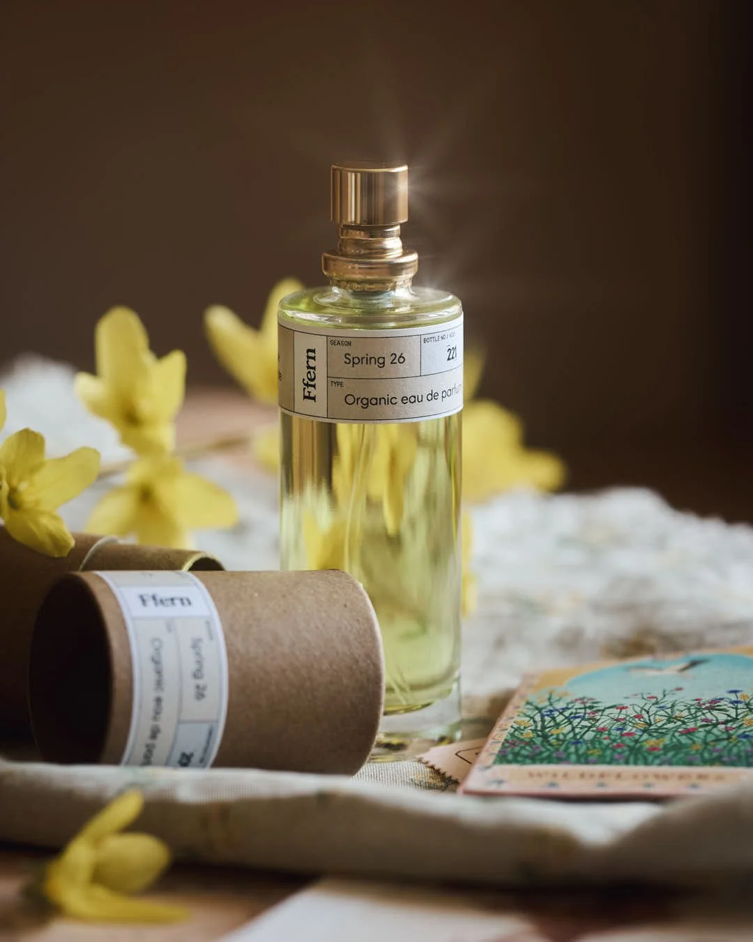 straight on image of perfume with start sparkles