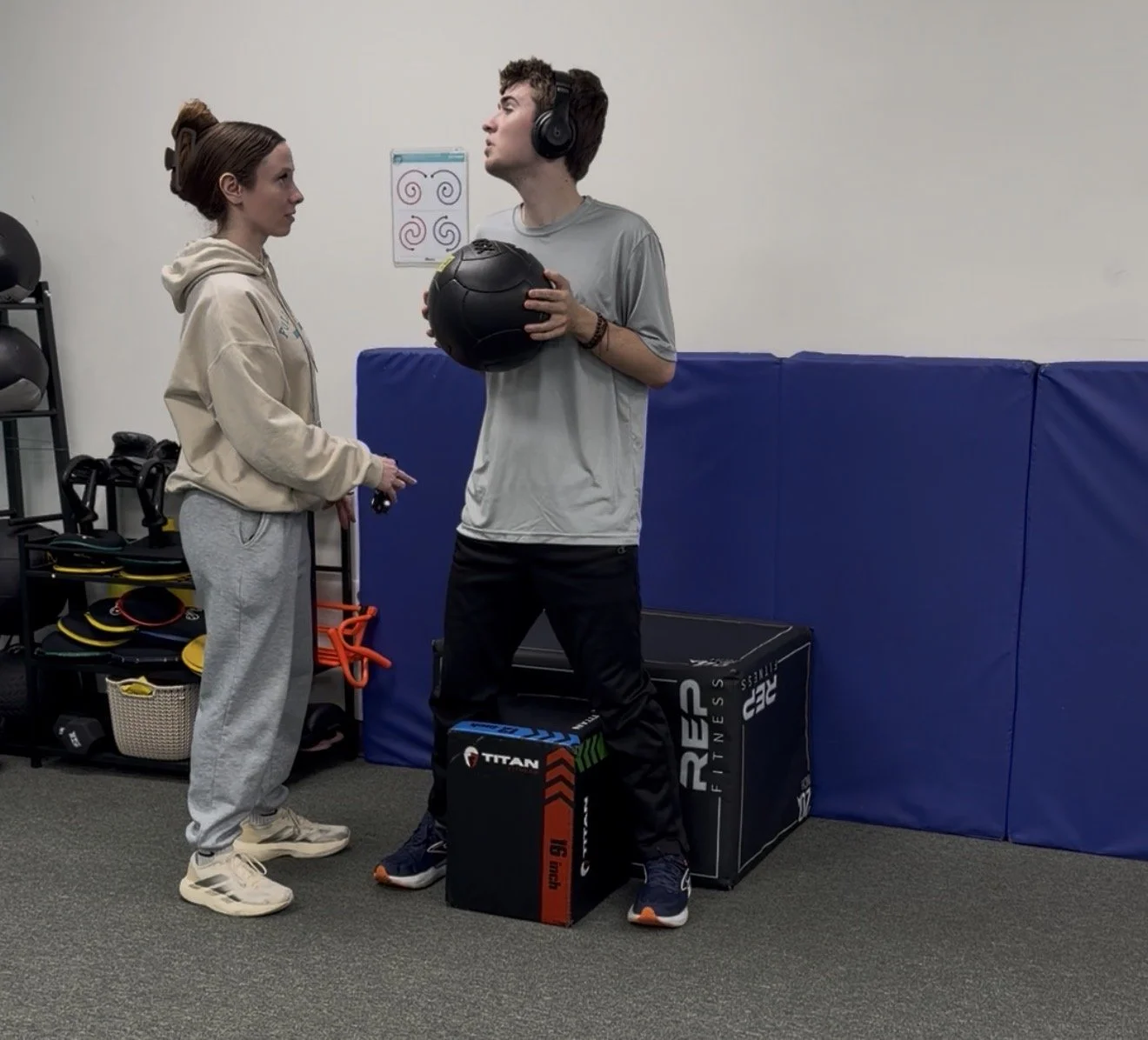 Trainer working with autistic participant during supported exercise session