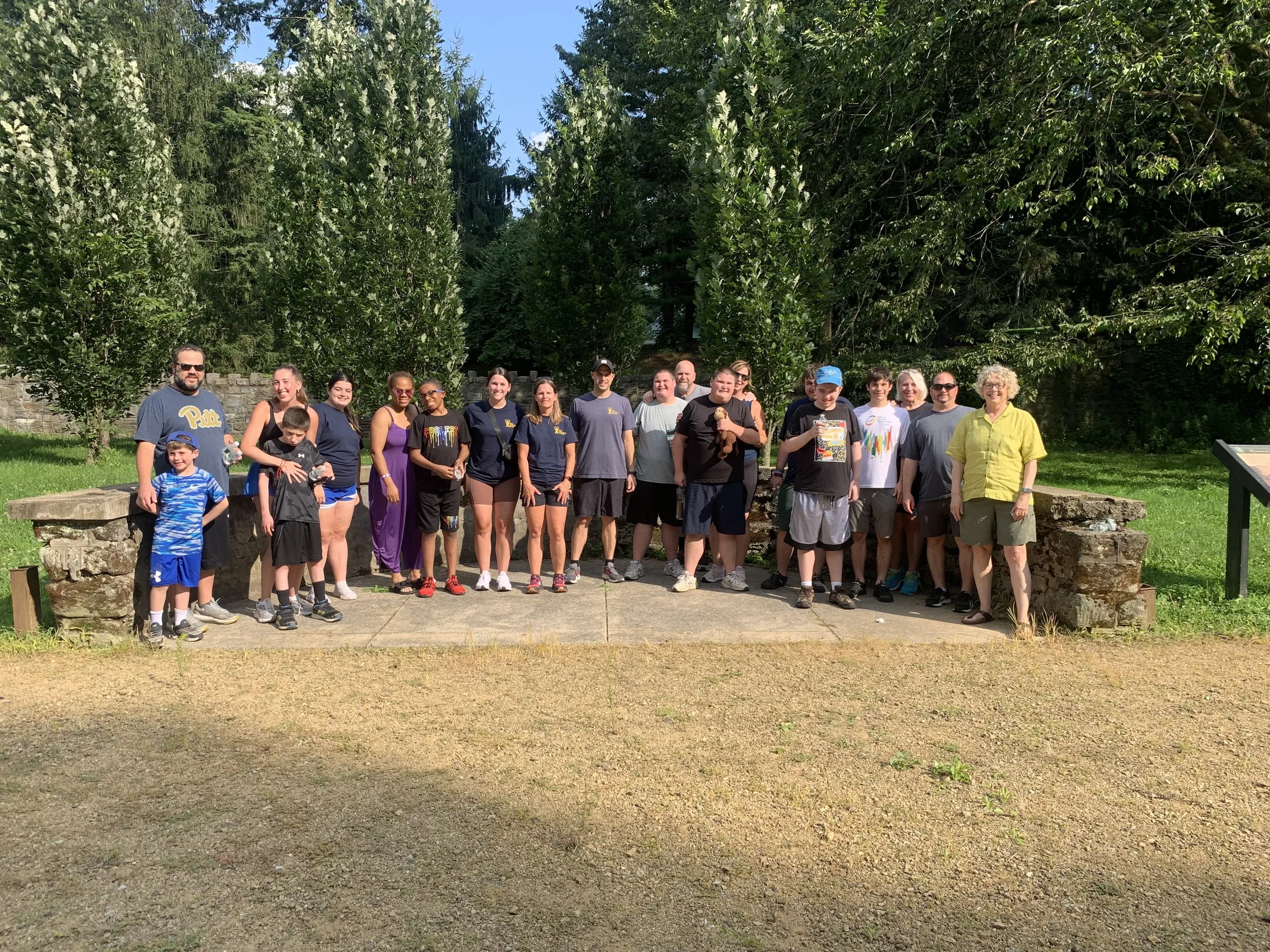 Neurodivergent participants socializing during community fitness event in Lower Merion, PA