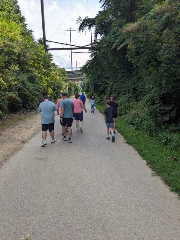 Group of autistic individuals walking together during exercise session in Delaware County