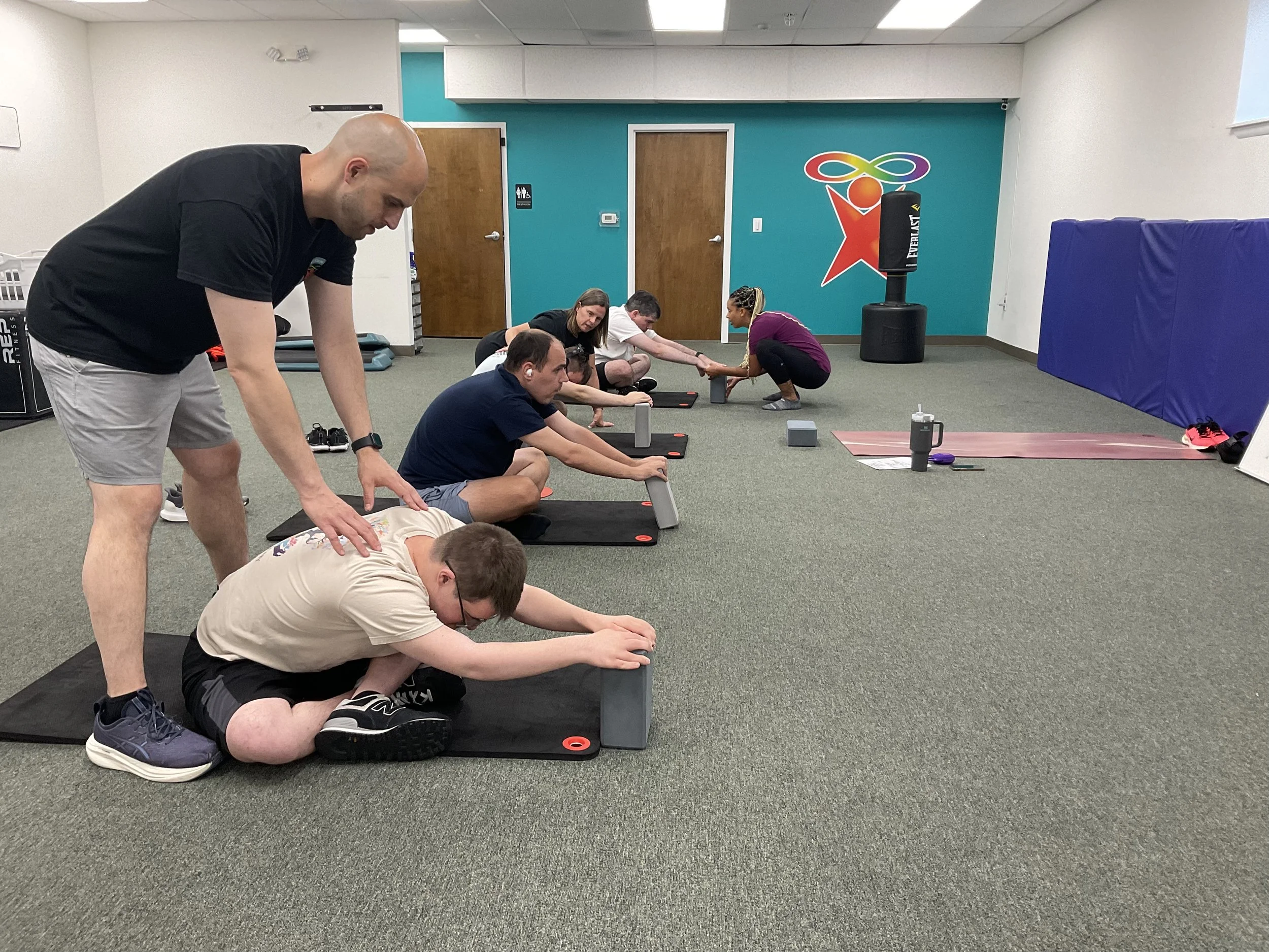 Group yoga class for autistic and neurodivergent individuals at Full Spectrum Fitness