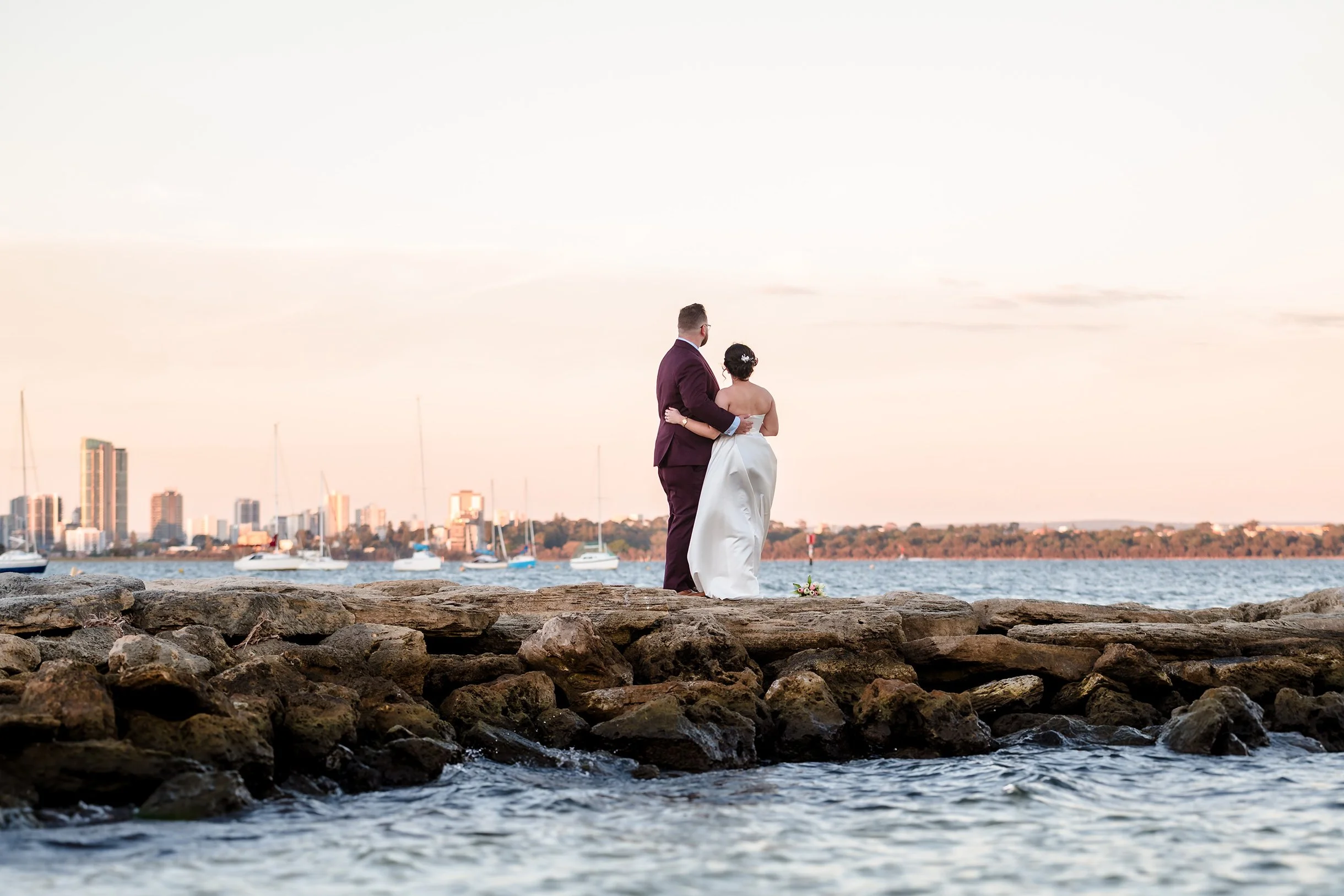 Wedding couple looking out over the Swan River Perth