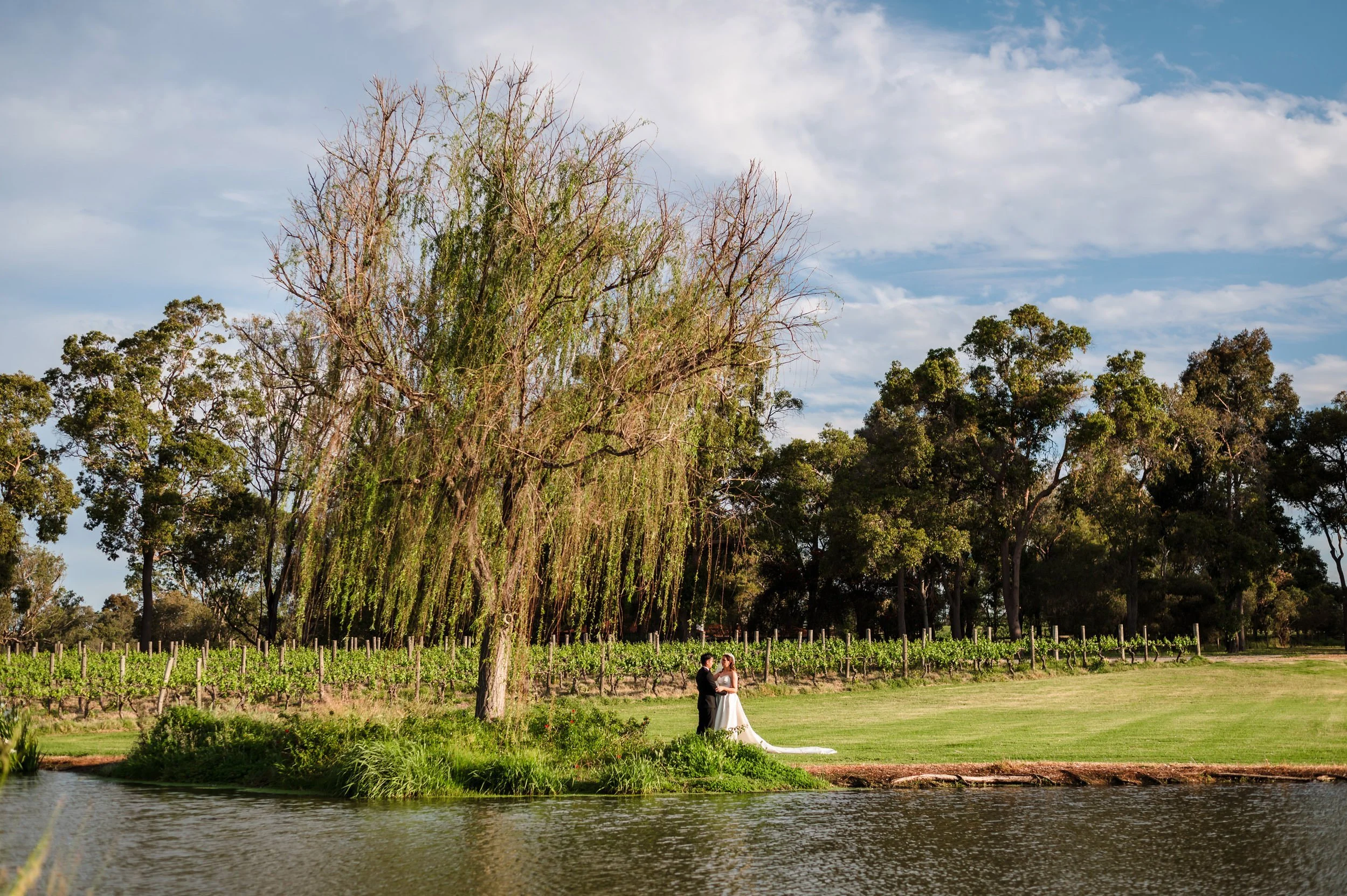 Couple near the vineyards at their Sandalford Winery wedding in the Swan Valley.