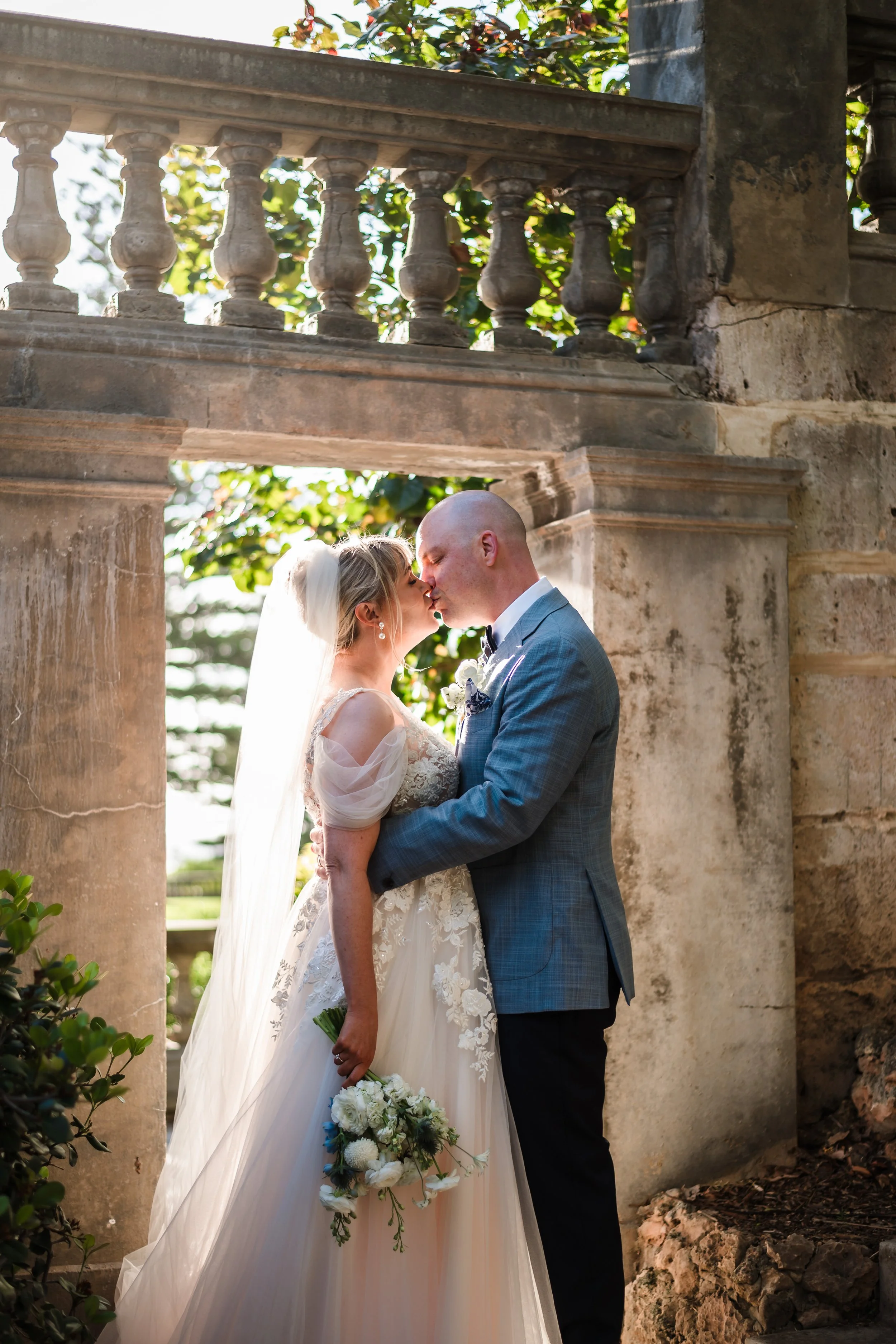 romantic backlit wedding portrait at cottesloe civic centre