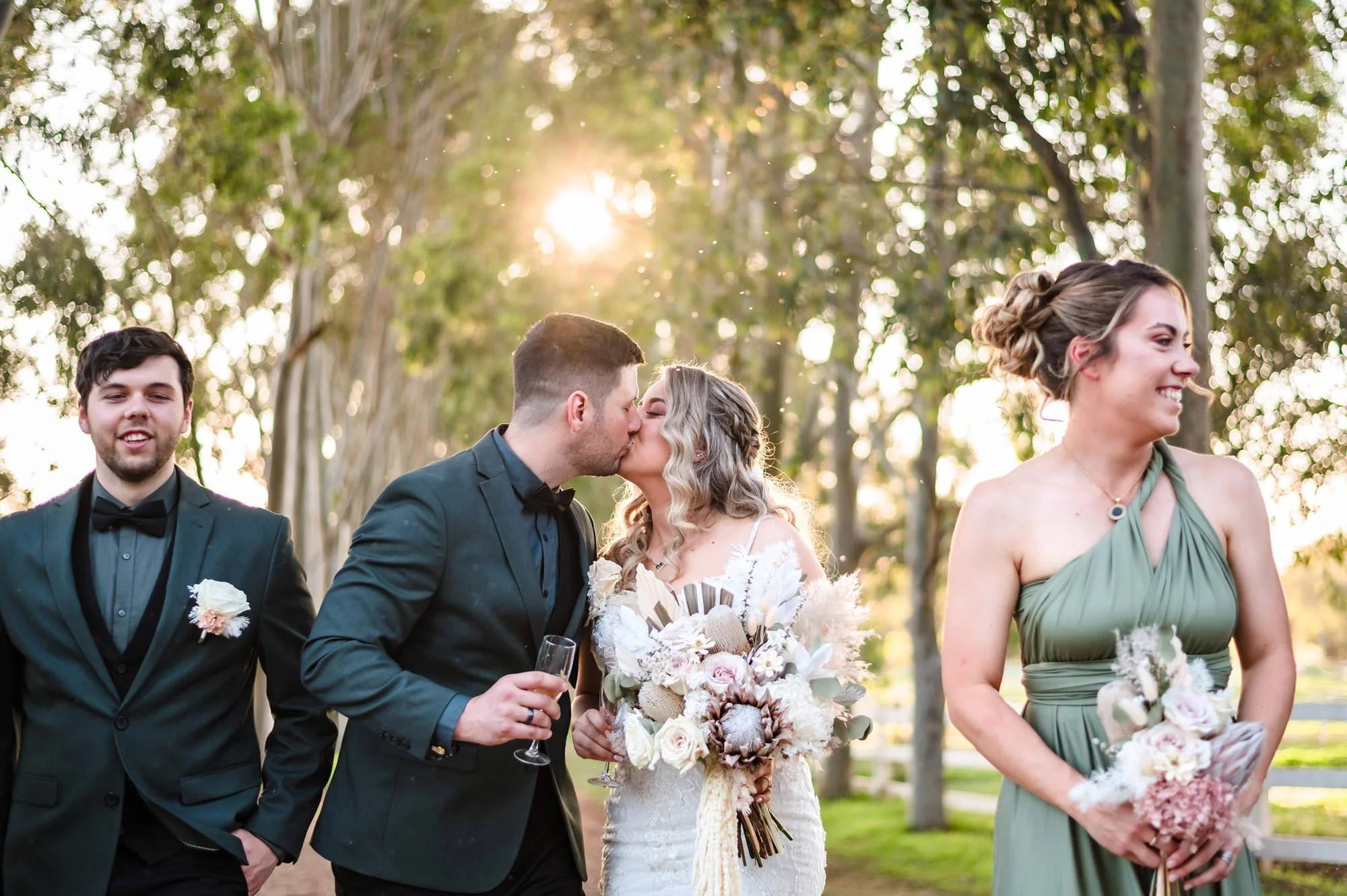 Candid inbetween moment of a couple and bridal party at Brookleigh Estate in the Swan Valley