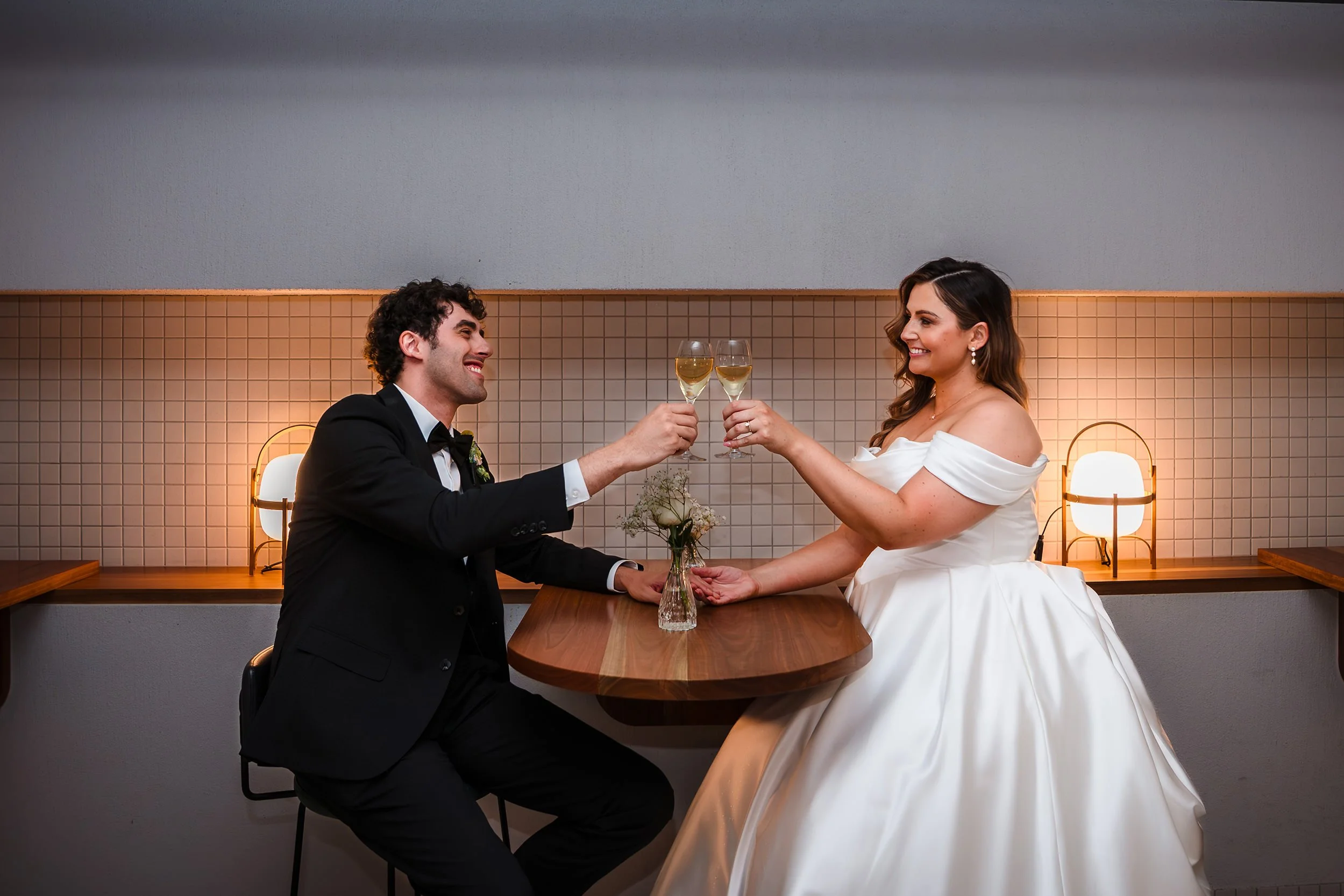 wedding couple toasting champagne at their Cooee Perth wedding reception