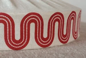 the-worm,-turning-in-dark-red-detail.webp