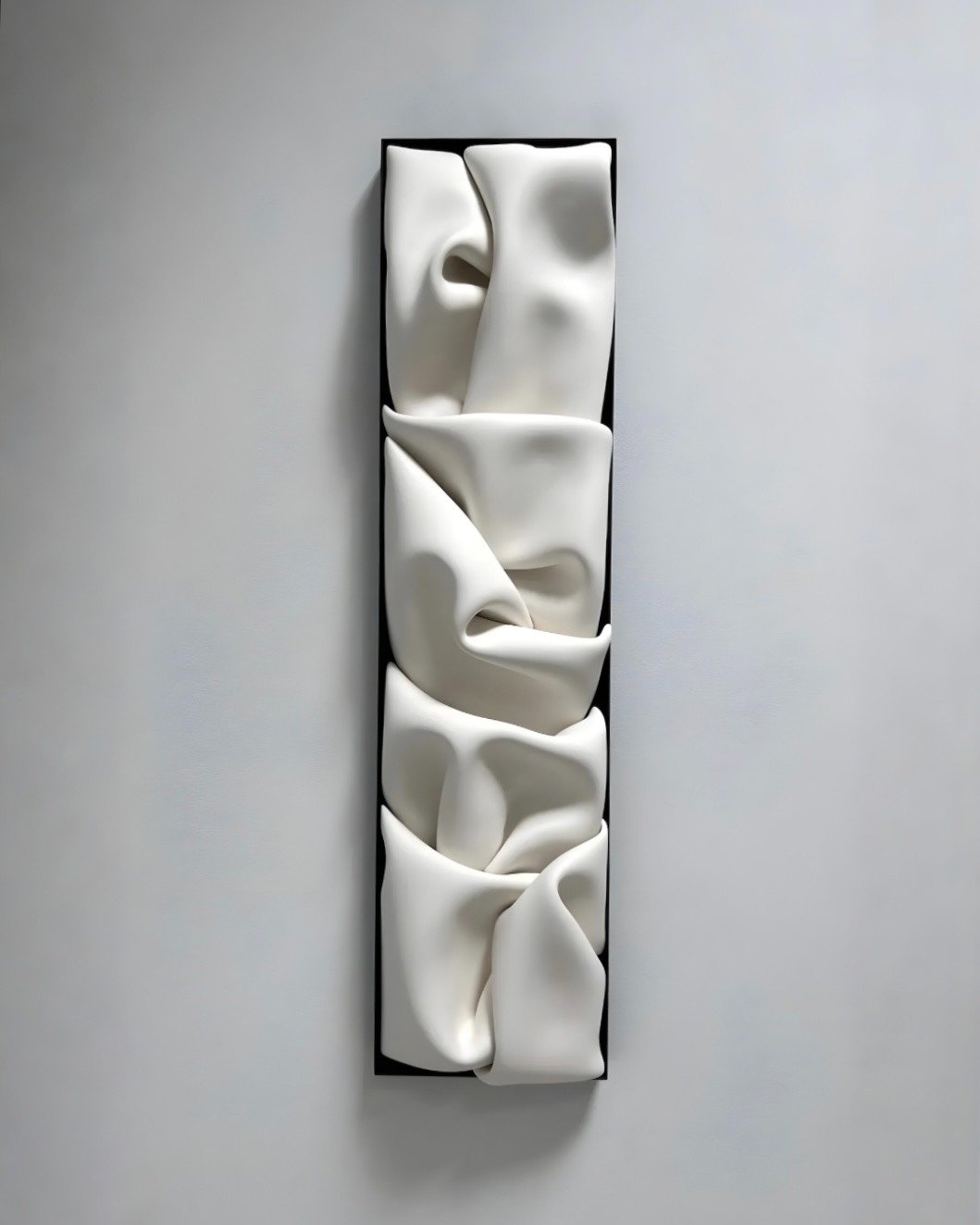 Another 🔴 is in order | This insanely beautiful porcelain sculpture has found its home. 
Artist: Jeannine Marchand "Folds XIX"
Clay, Steel &amp; Wood | 12" x 48"

#mirrorballgallery #wncart #sculpture #sculptureartist #tryonnc