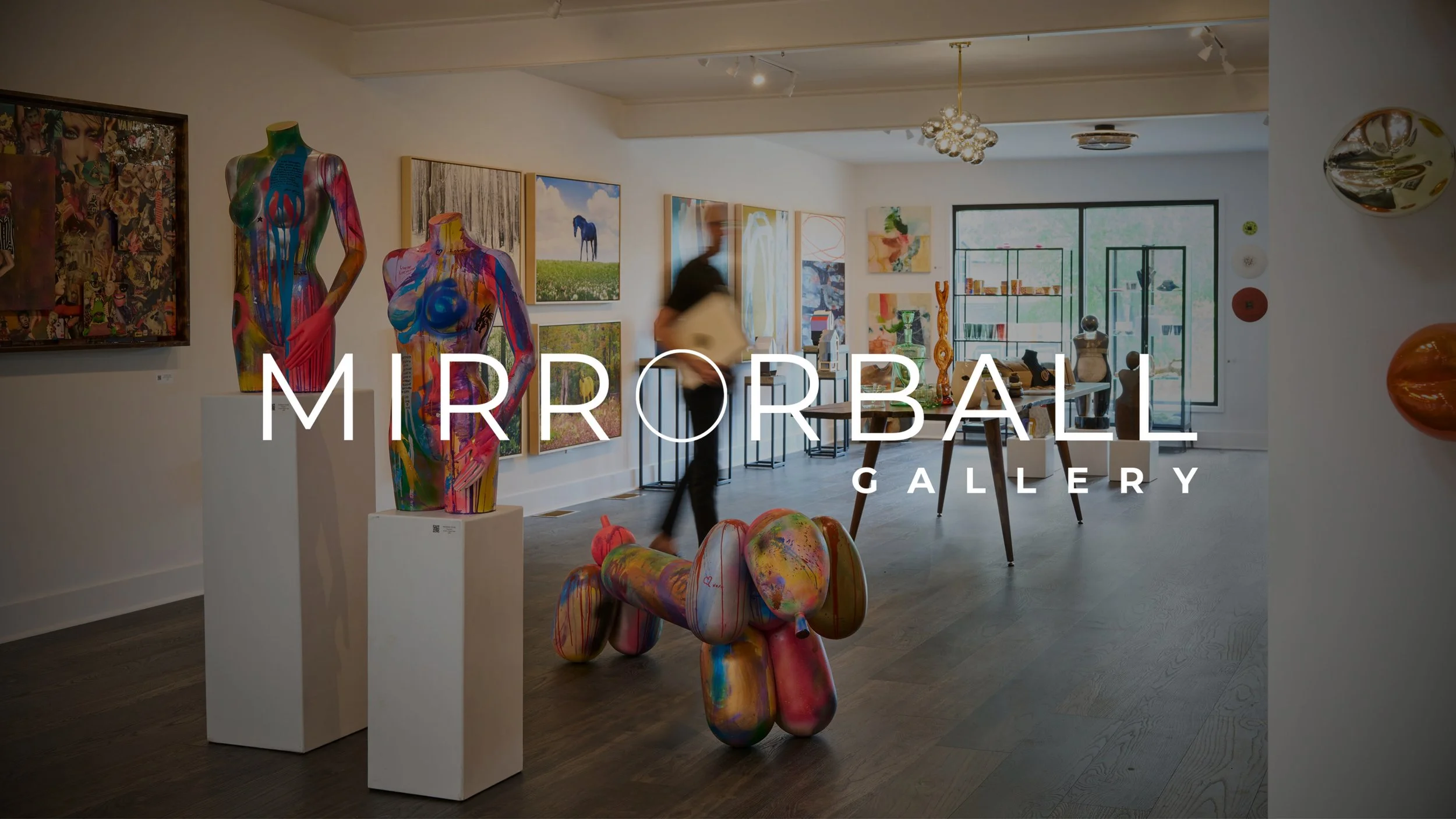 Interior view of Mirrorball Art Gallery in Tryon, North Carolina, featuring contemporary photography by Monica Stevenson.