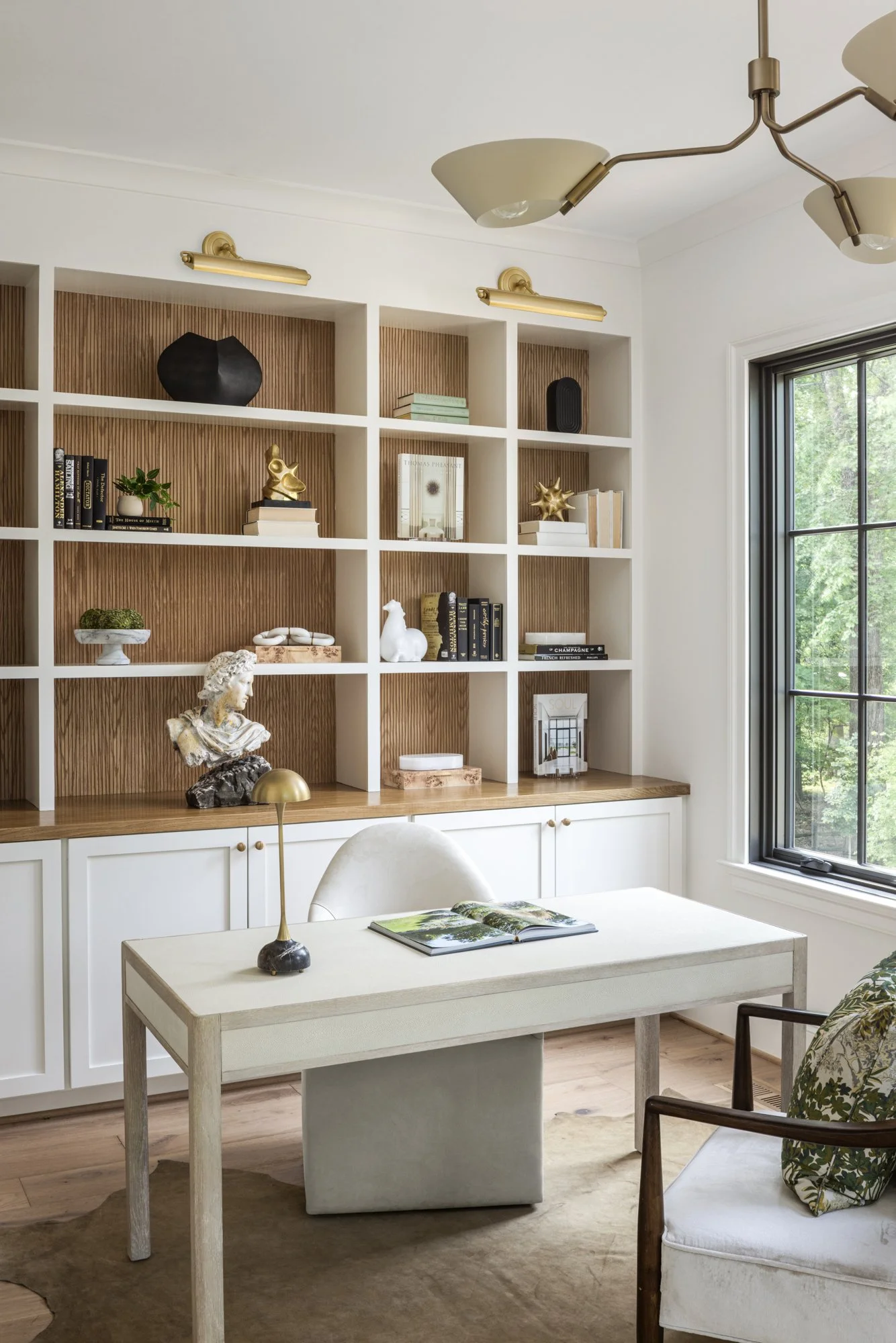 Built-in office cabinetry in tailored traditional home by Wellhouse & Co.