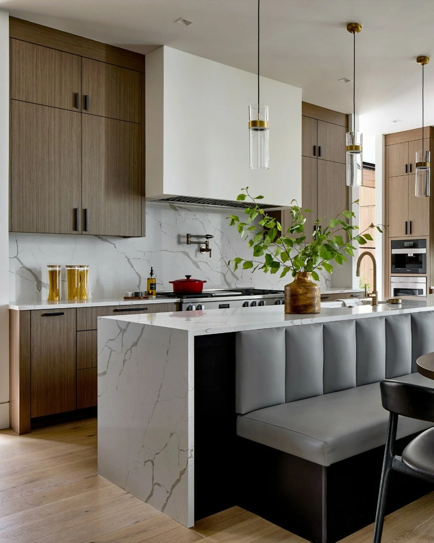 We designed a banquette custom for this family, and it might be our favorite thing we've ever built into a kitchen!  Space was tight in the breakfast area and the banquette was the perfect solution, and we used a vinyl fabric to stand up to every day