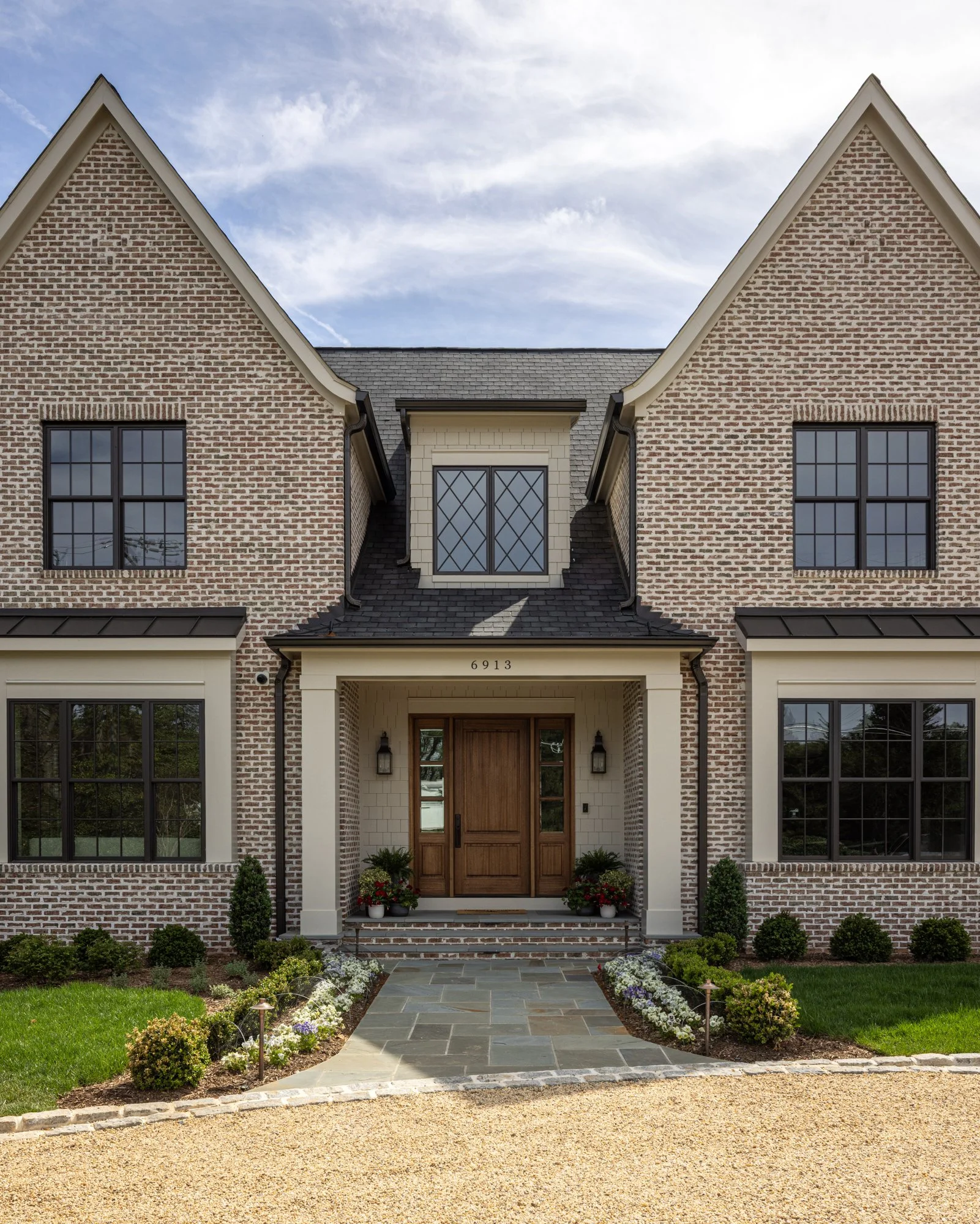 Front entrance of modern classic estate home by Wellhouse & Co.