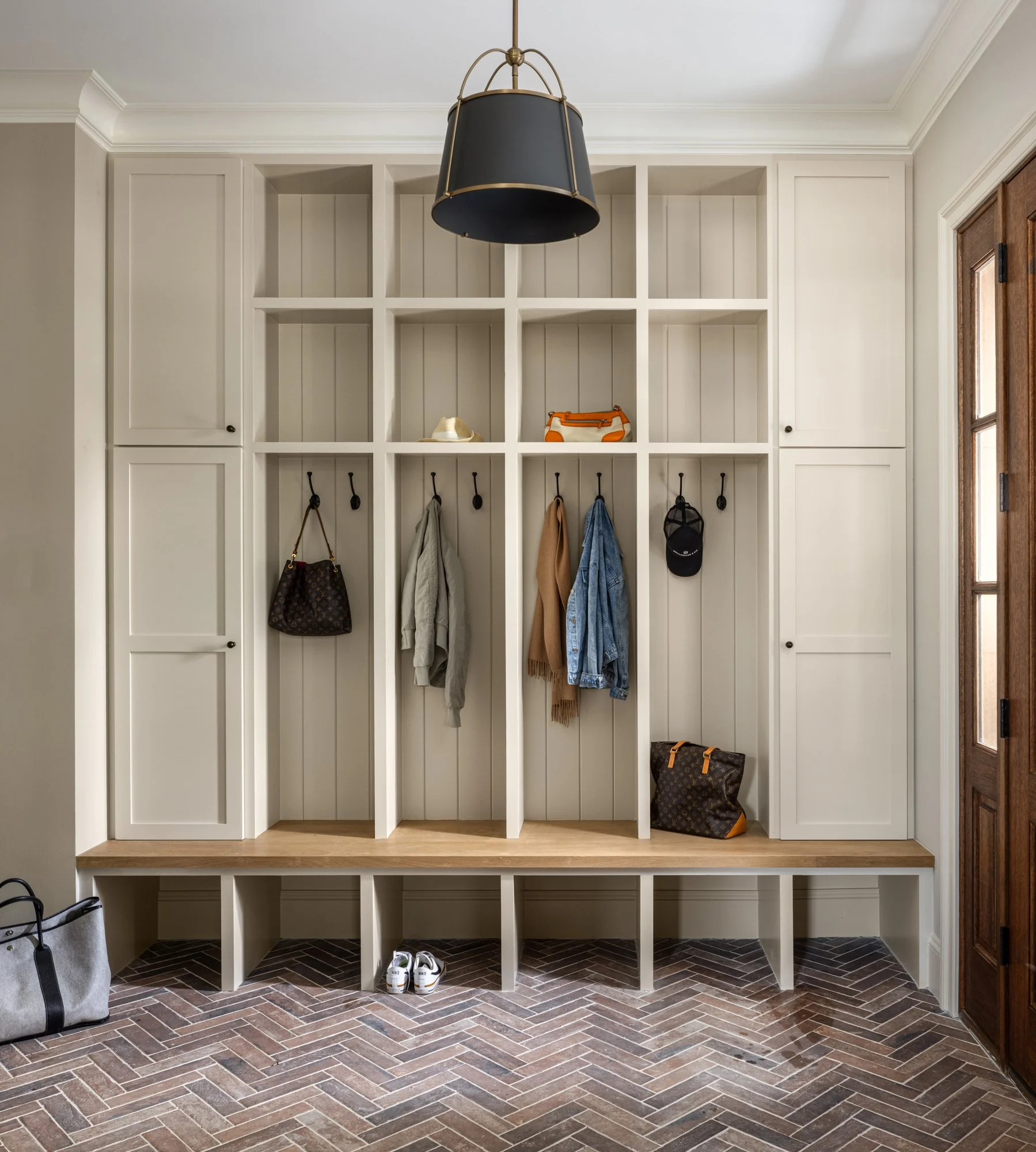 Custom mudroom storage and cabinetry in modern classic estate by Wellhouse & Co.