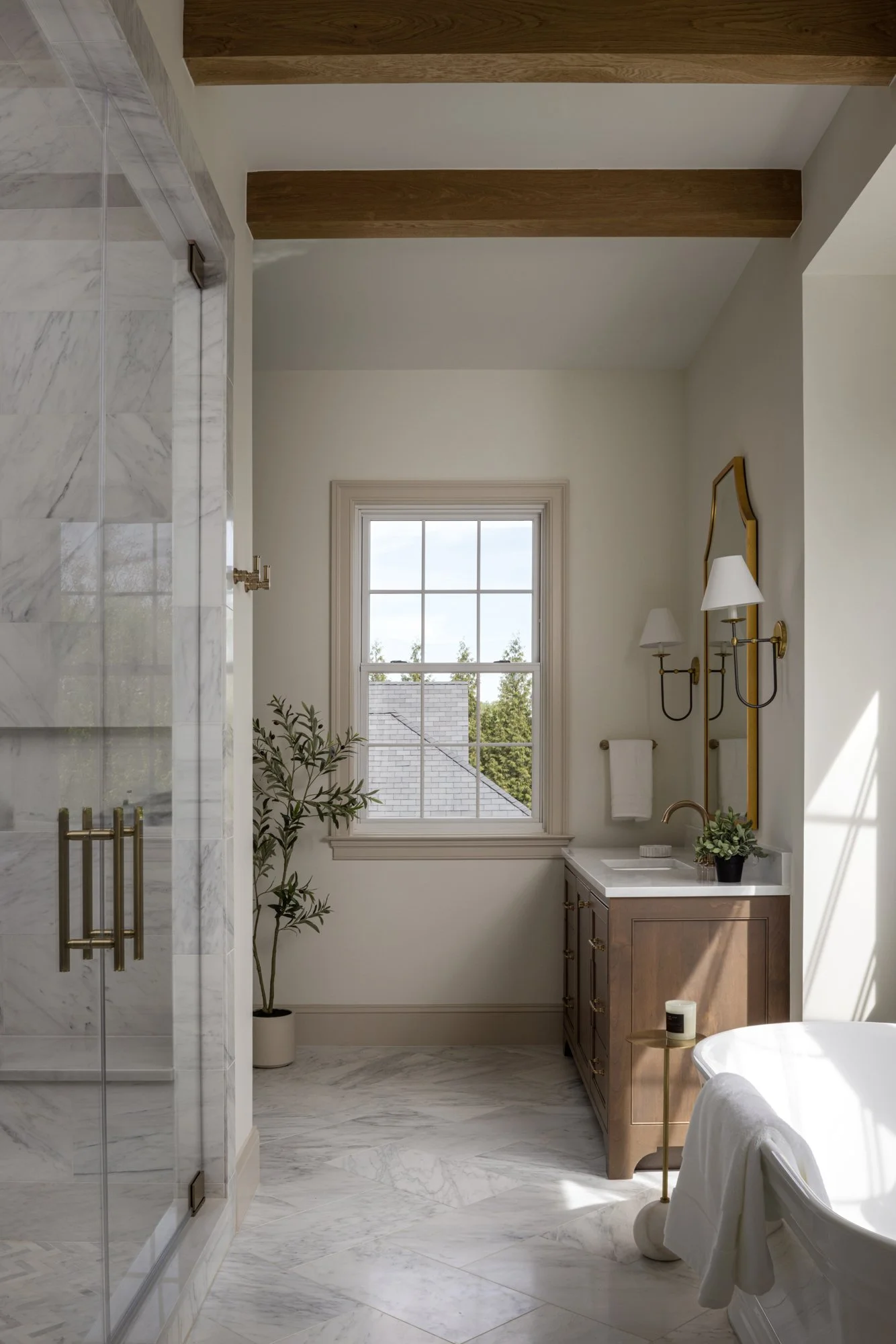 Luxury walk-in shower in modern classic estate bathroom by Wellhouse & Co.