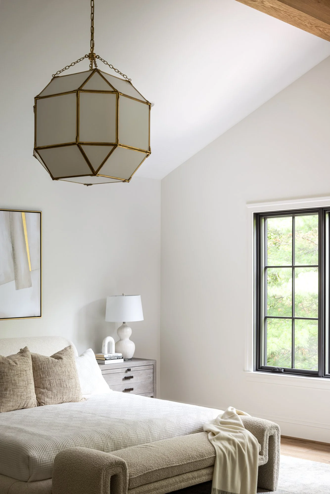 Bedroom interior with decorative lighting in tailored traditional home by Wellhouse & Co.