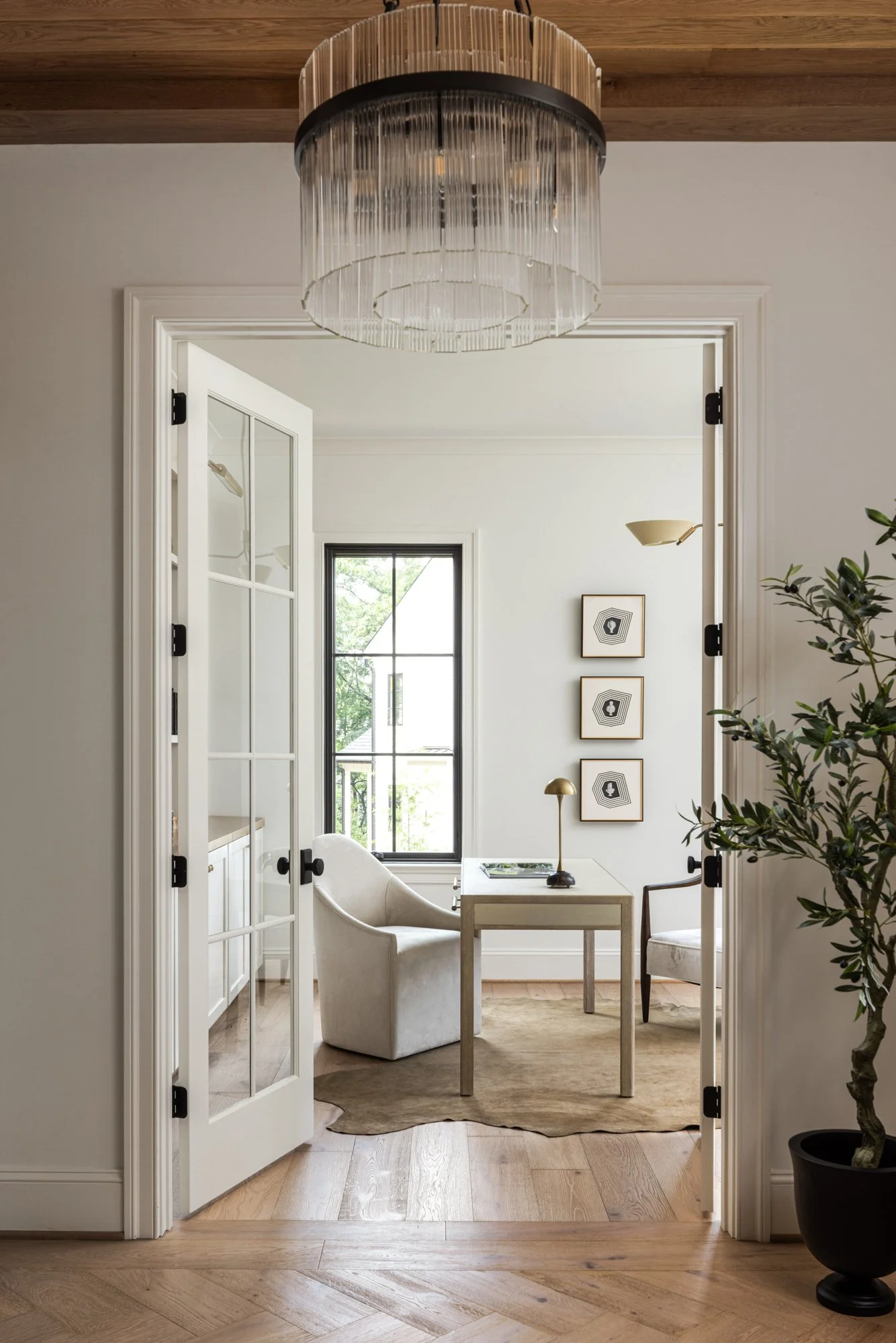 Workspace lighting fixture detail in tailored traditional home by Wellhouse & Co.