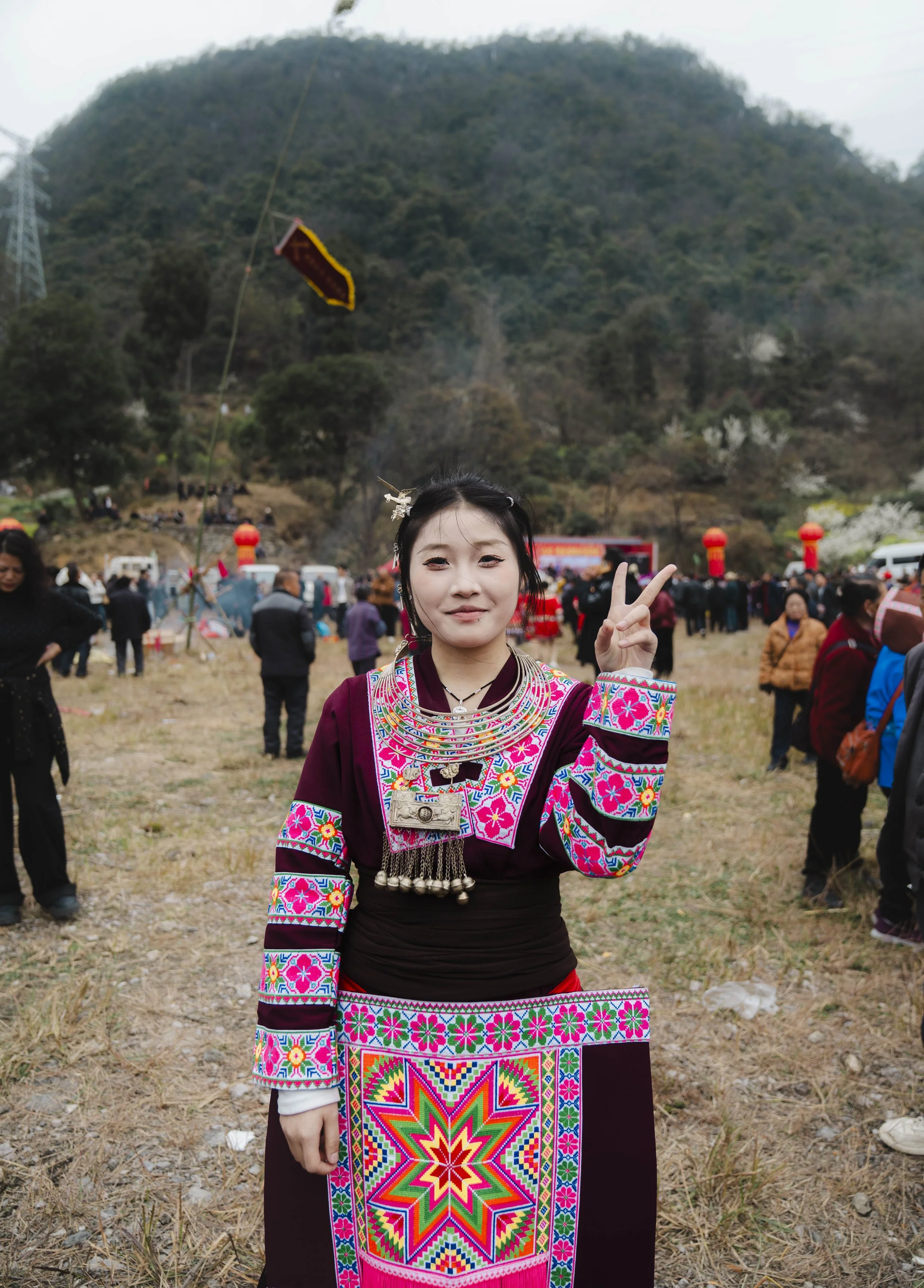 A young woman during a festival on the outskirts of Guiyang. Guizhou, 2026