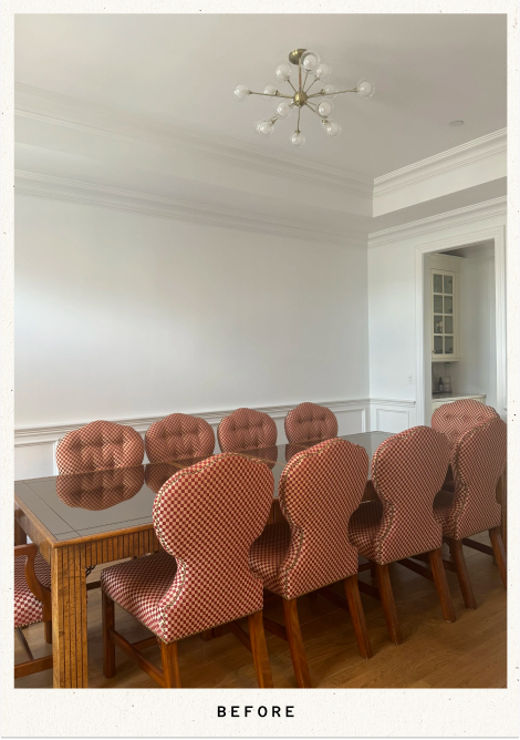 Traditional dining room with a wood table, red-and-white checkered upholstered chairs, white paneled walls, and a midcentury starburst chandelier.