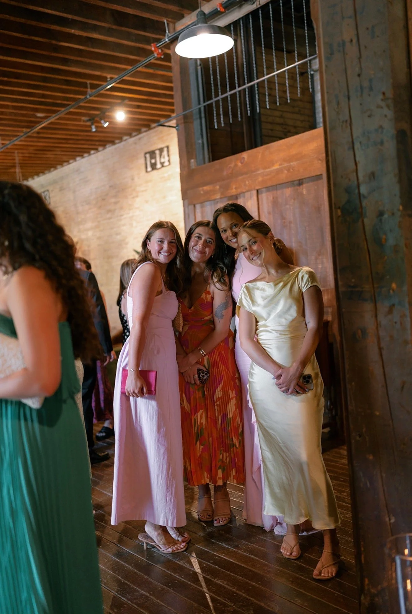 Summer Wedding Guests in The Lageret Foyer smiling in a group photo
