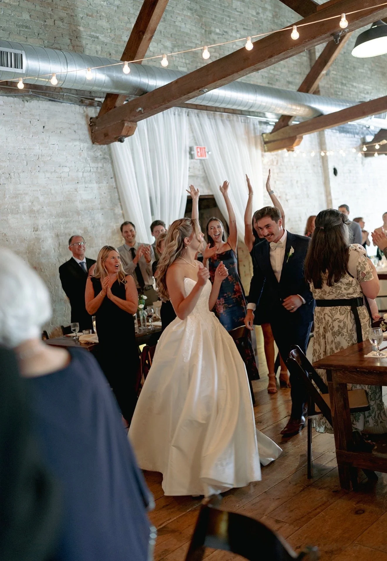 Lively Reception at The Lageret with bride and groom entering the dining area