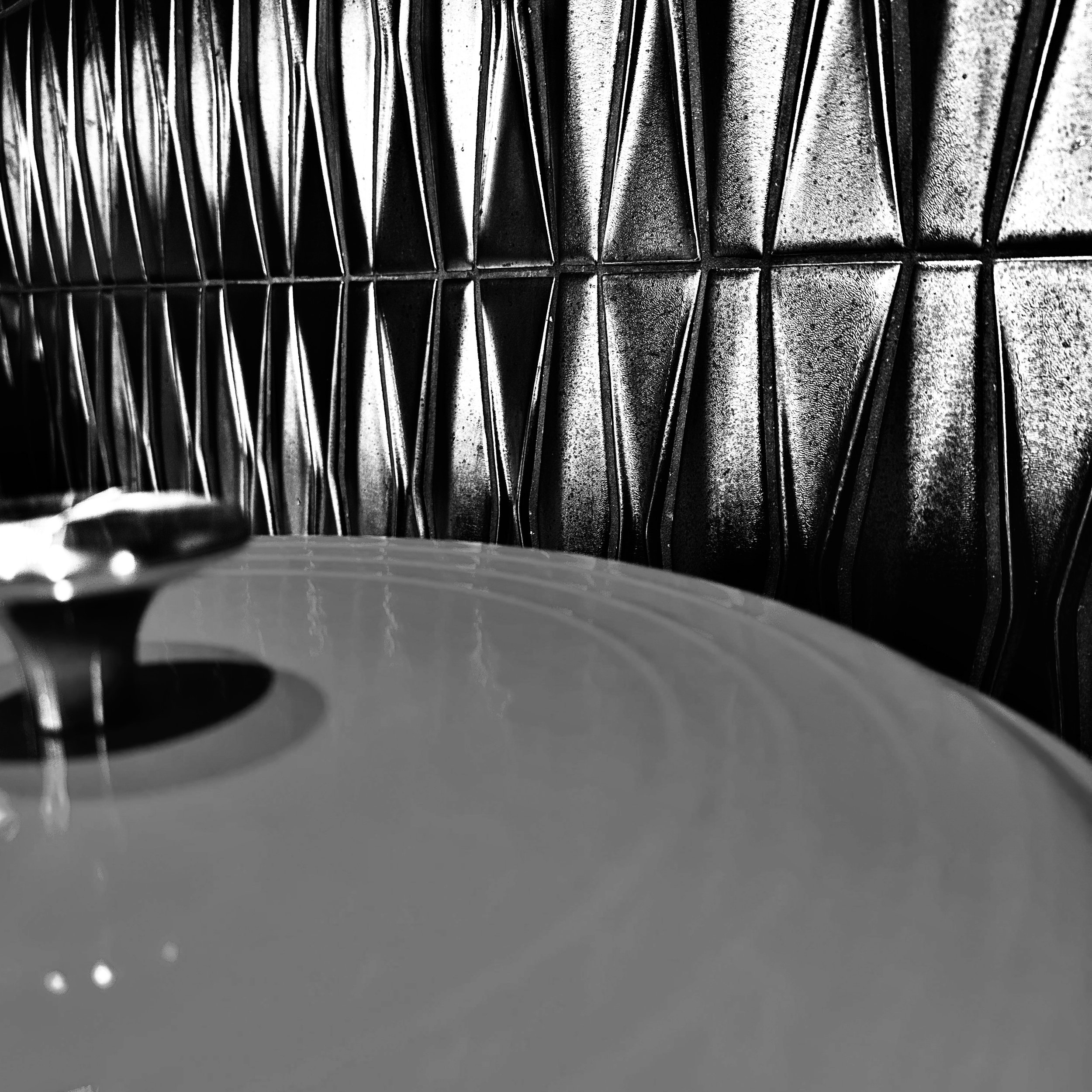 Pot Against Backsplash Textural Contrast