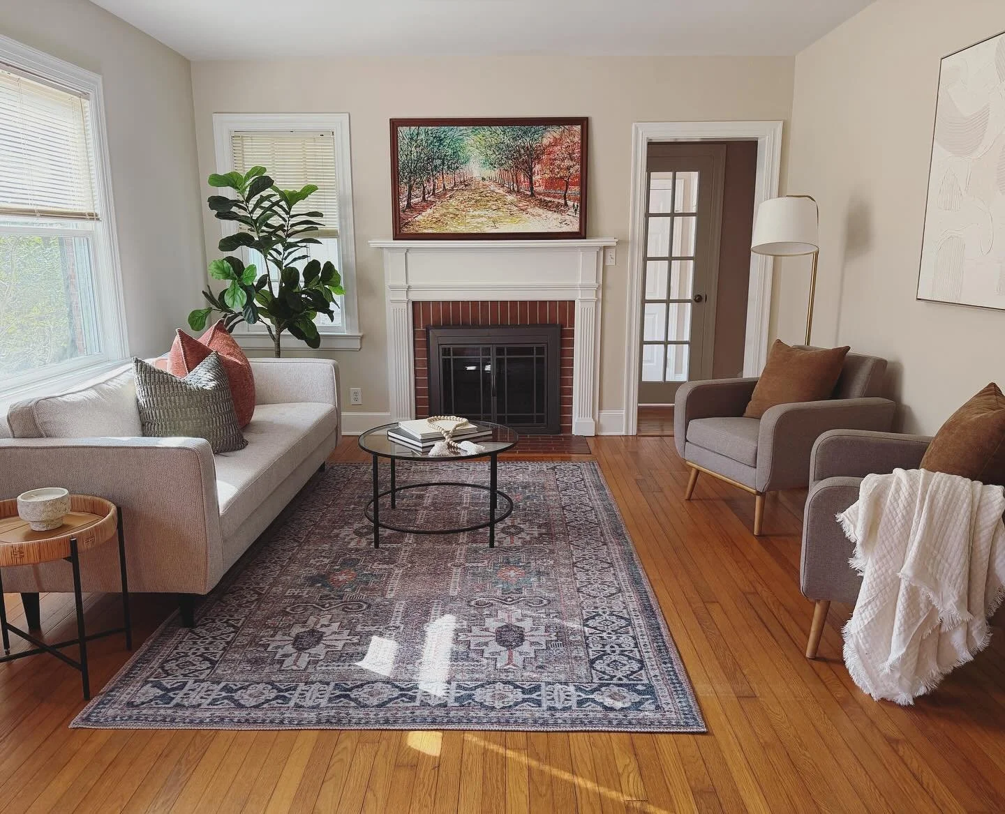 It can be tricky to create a furniture layout when you have multiple doors in a room - and this one has 4 (you only see 1 from this view!). We created a couple of seating zones, aligned the rug with the edge of the fireplace&hellip;and DONE&hellip;yo