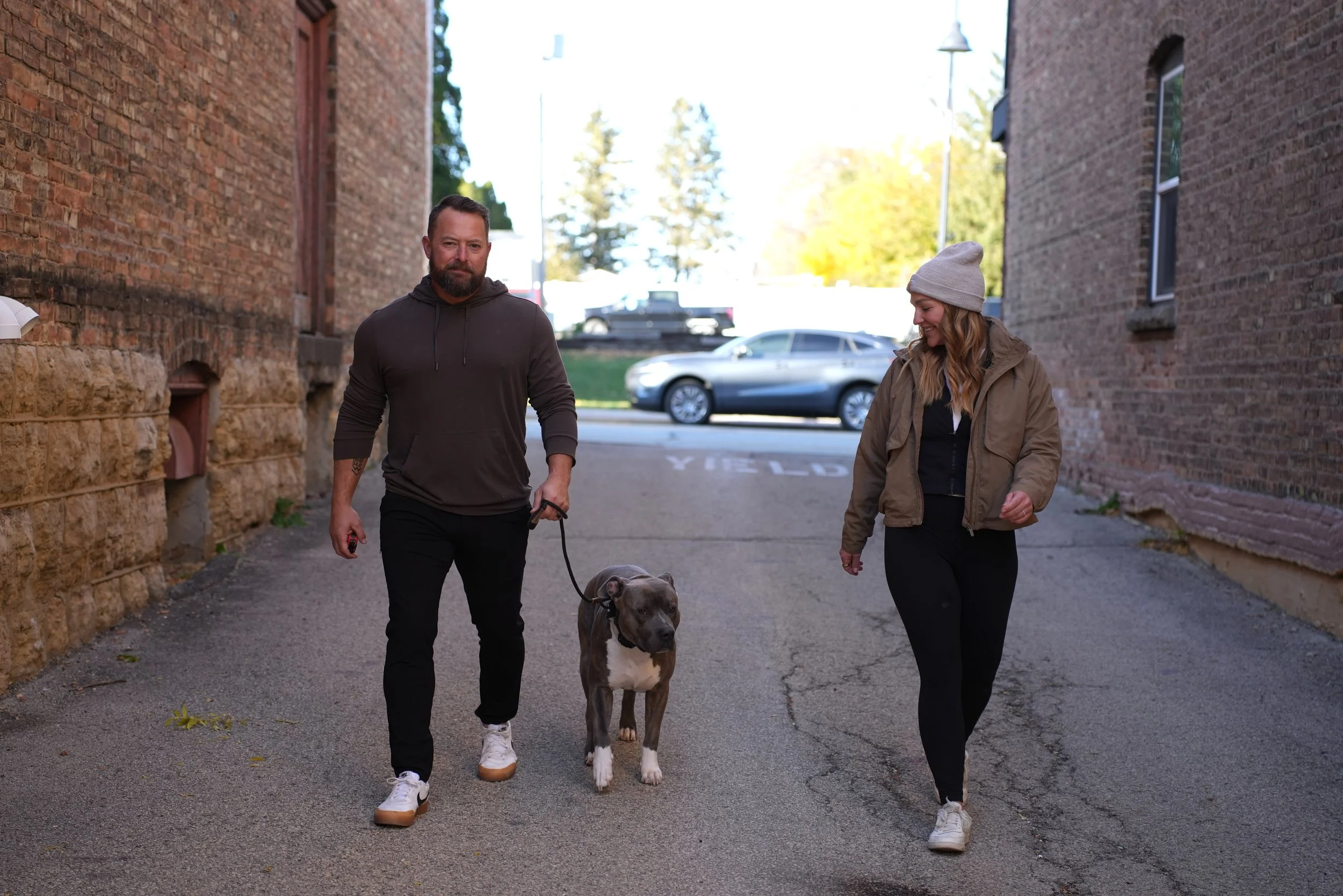 Dog trainer coaching owner with dog