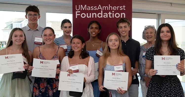 The 2026-27 Cape Cod Alumni Network Scholarship recipients gather for a photo with Scholarship Committee Chair Sheryl Lajoie '69.