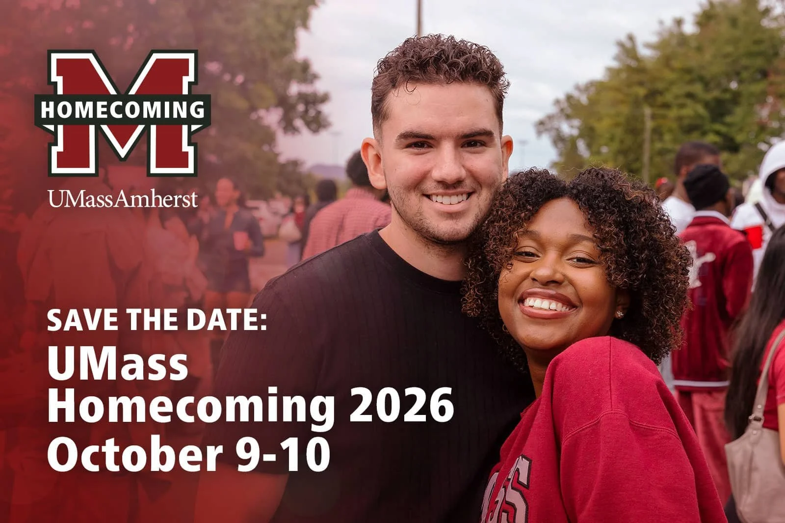 Alumni couple posing with UMass Amherst Homecoming logo. Save the Date: UMass Homecoming 2026. October 9–10