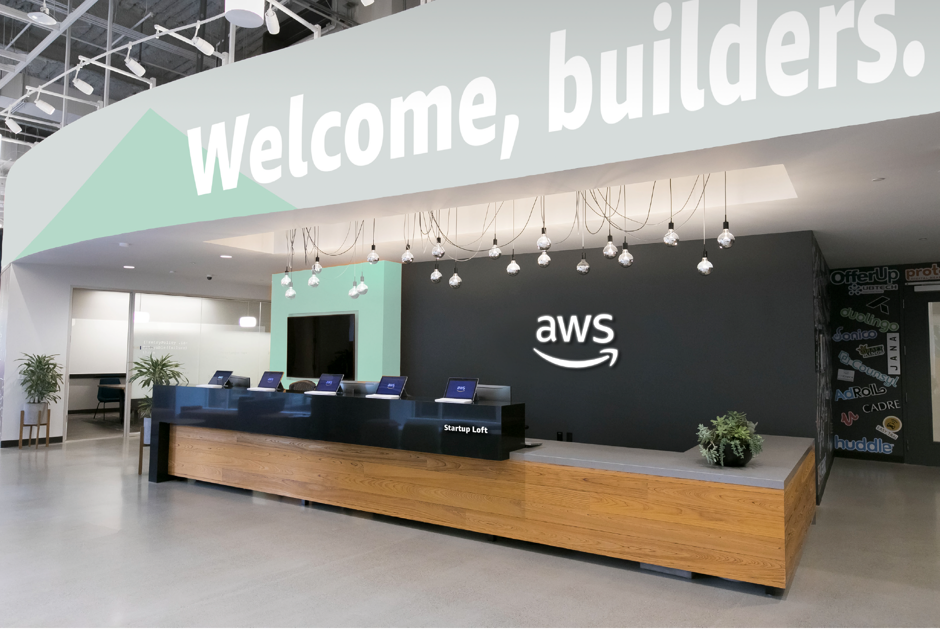 AWS reception area with branded graphics and logo on the wall