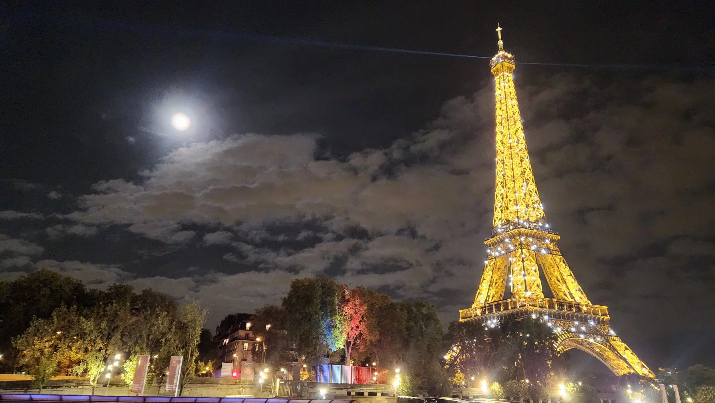 The Eiffel Tower sparkles at night in Paris, France