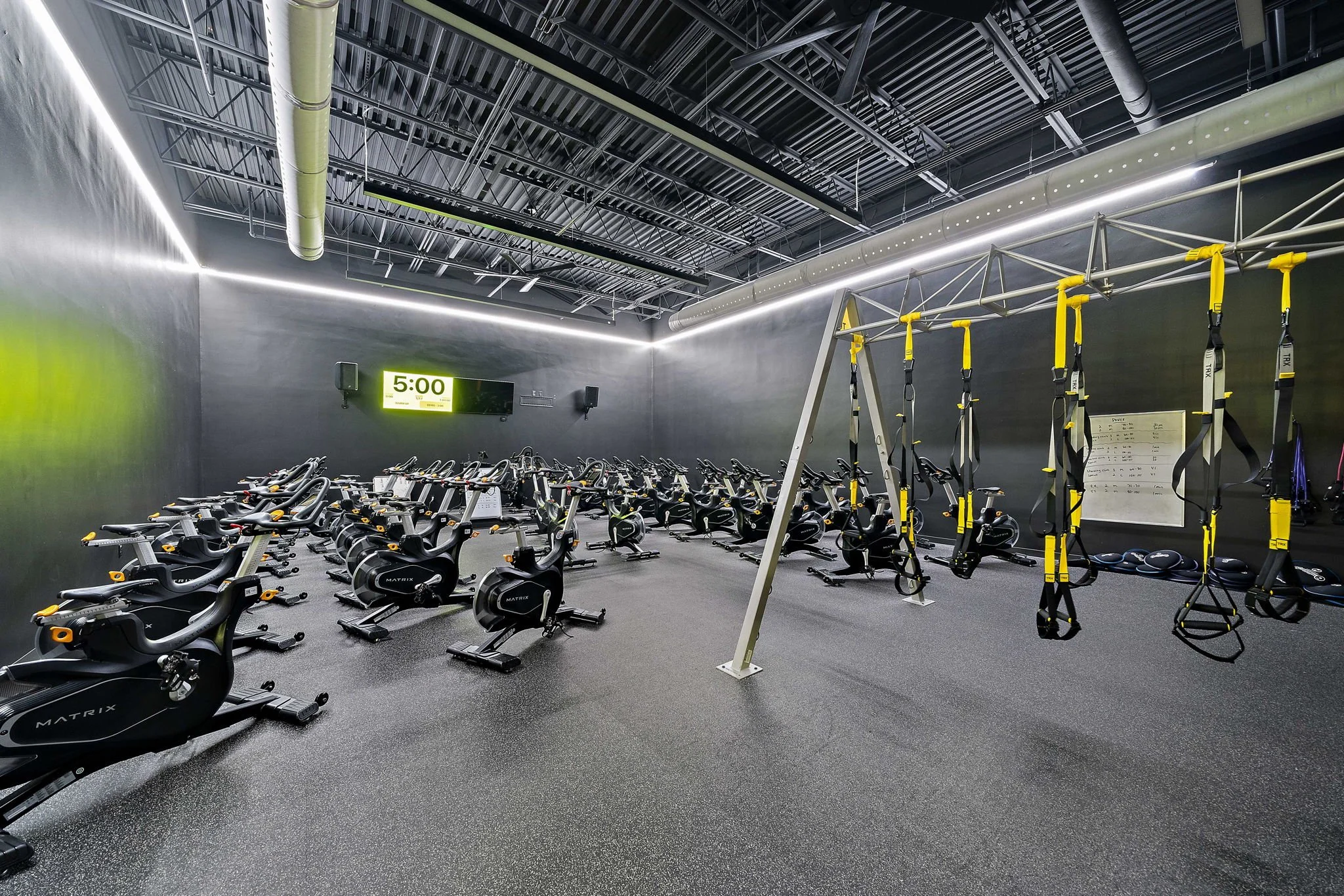 Spin or cycling studio at Best Fitness Woburn, MA designed by S3 Design. 