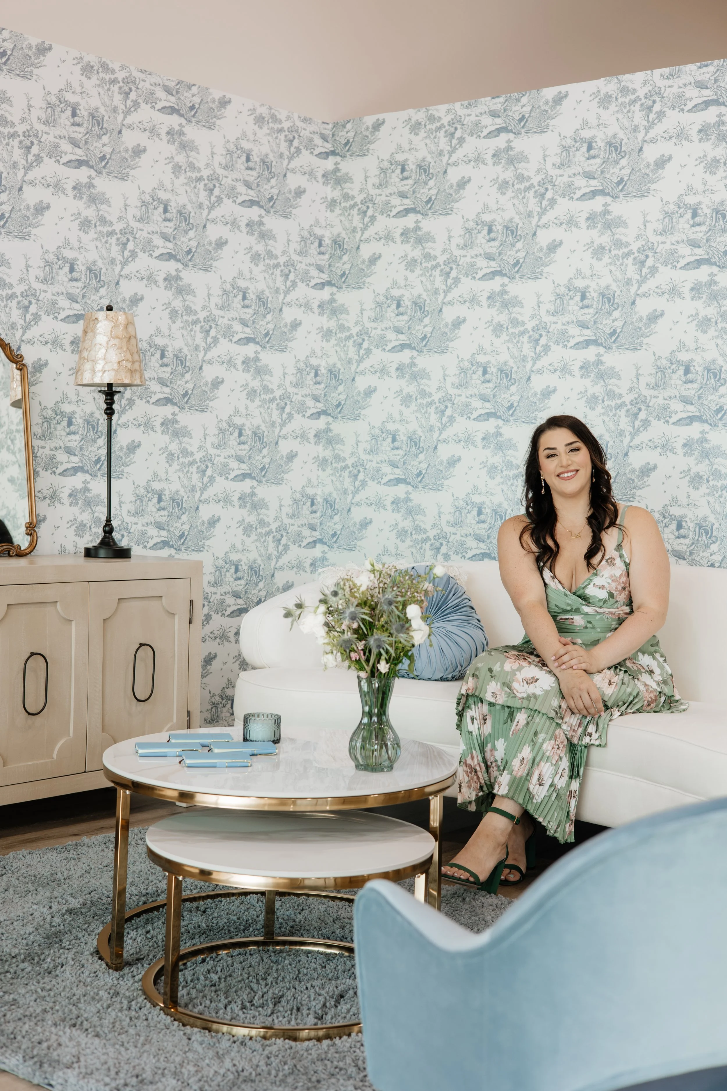 Hana Sitting on a couch in the store