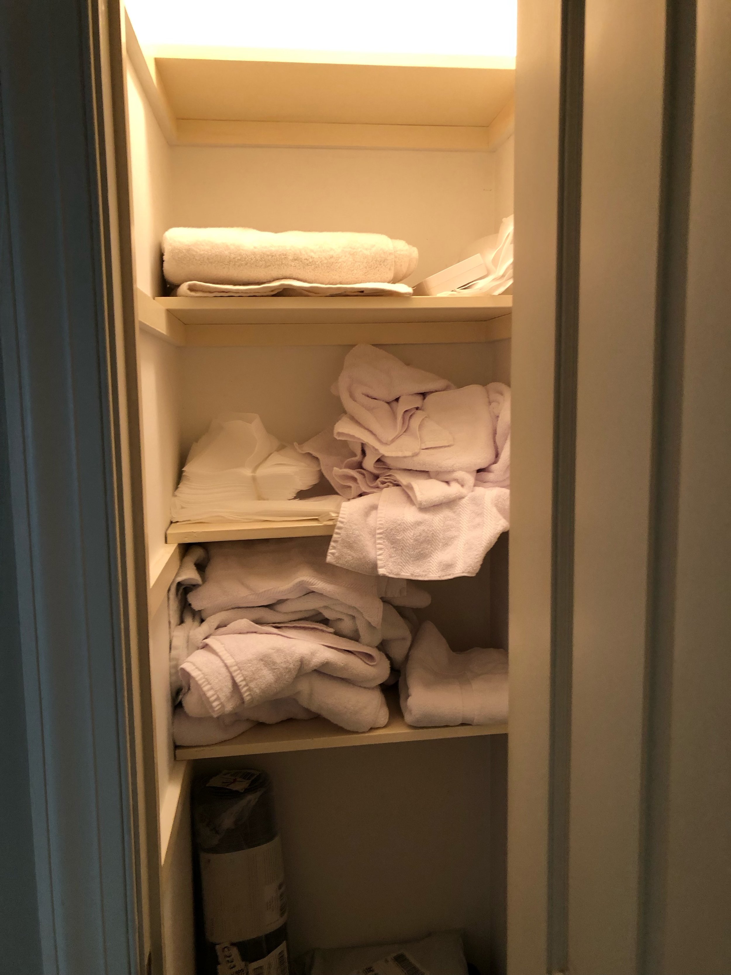 Guest house linen closet = Before