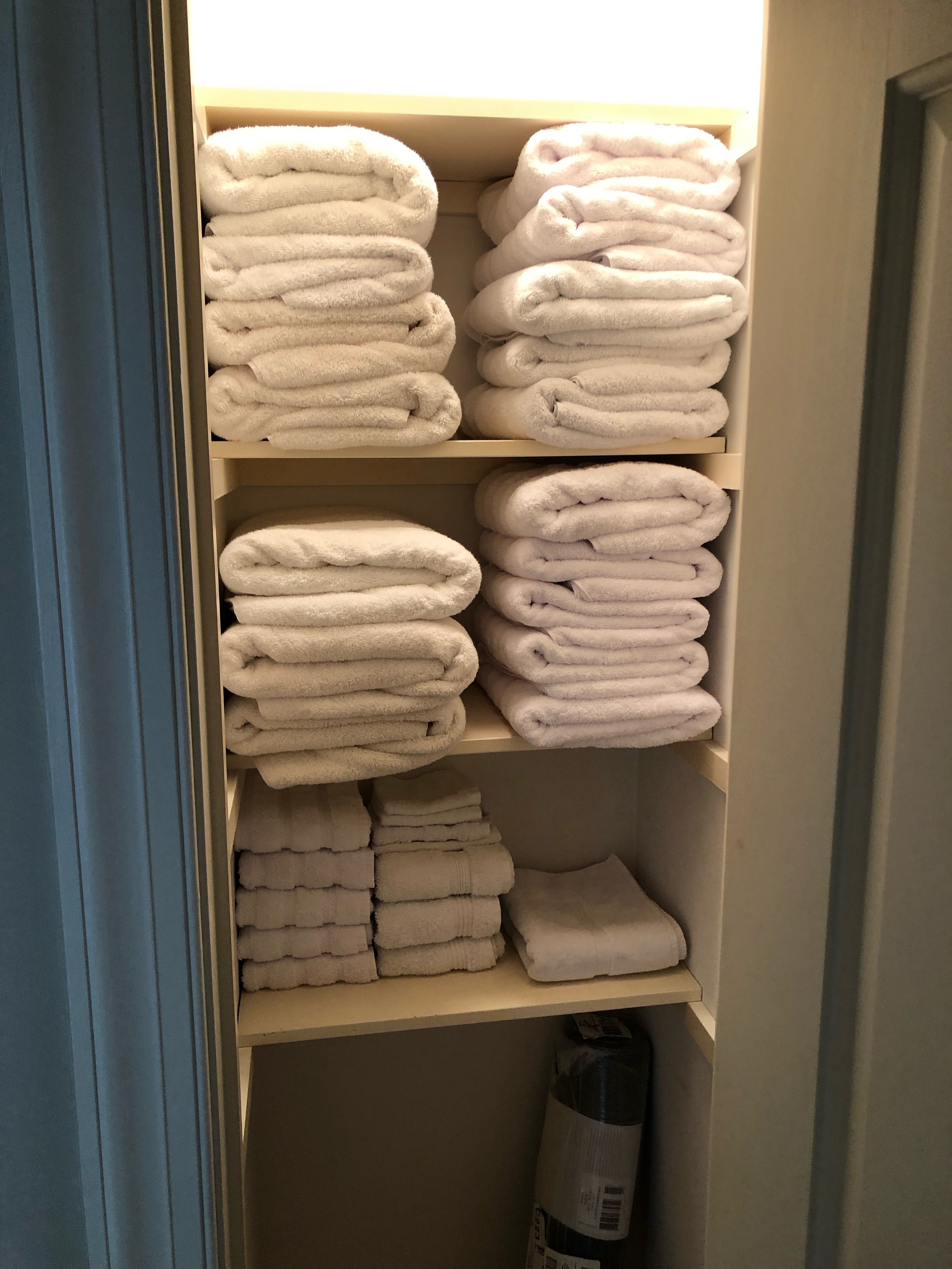 Guest house linen closet = Before
