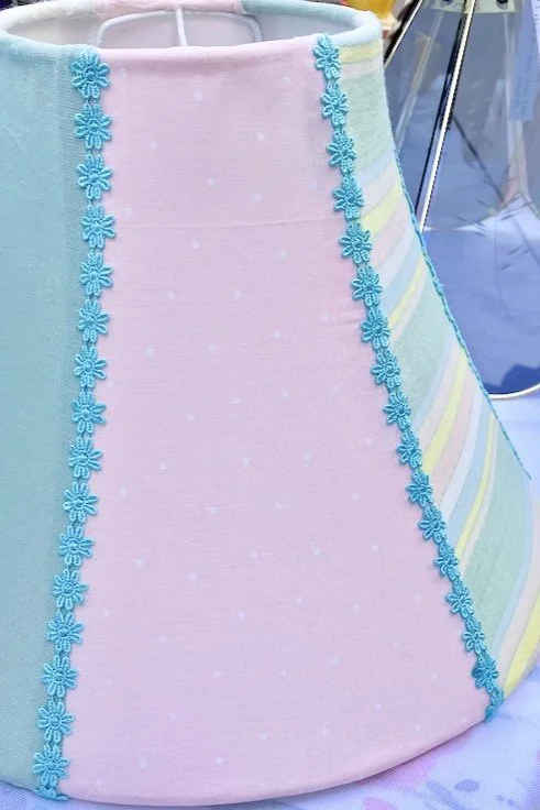 6-panel lampshade with pastel fabrics and teal blue floral trim.