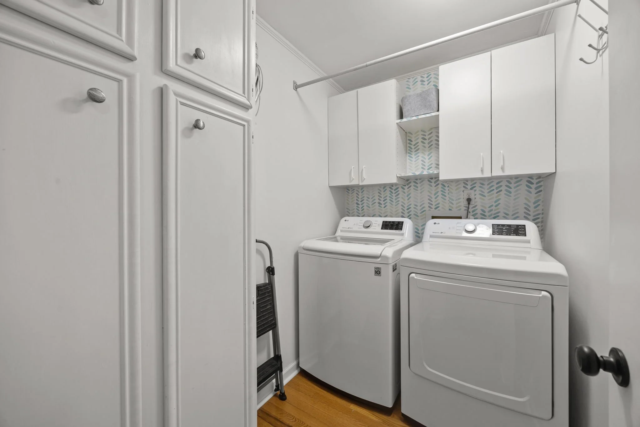 full-size laundry room with extra storage