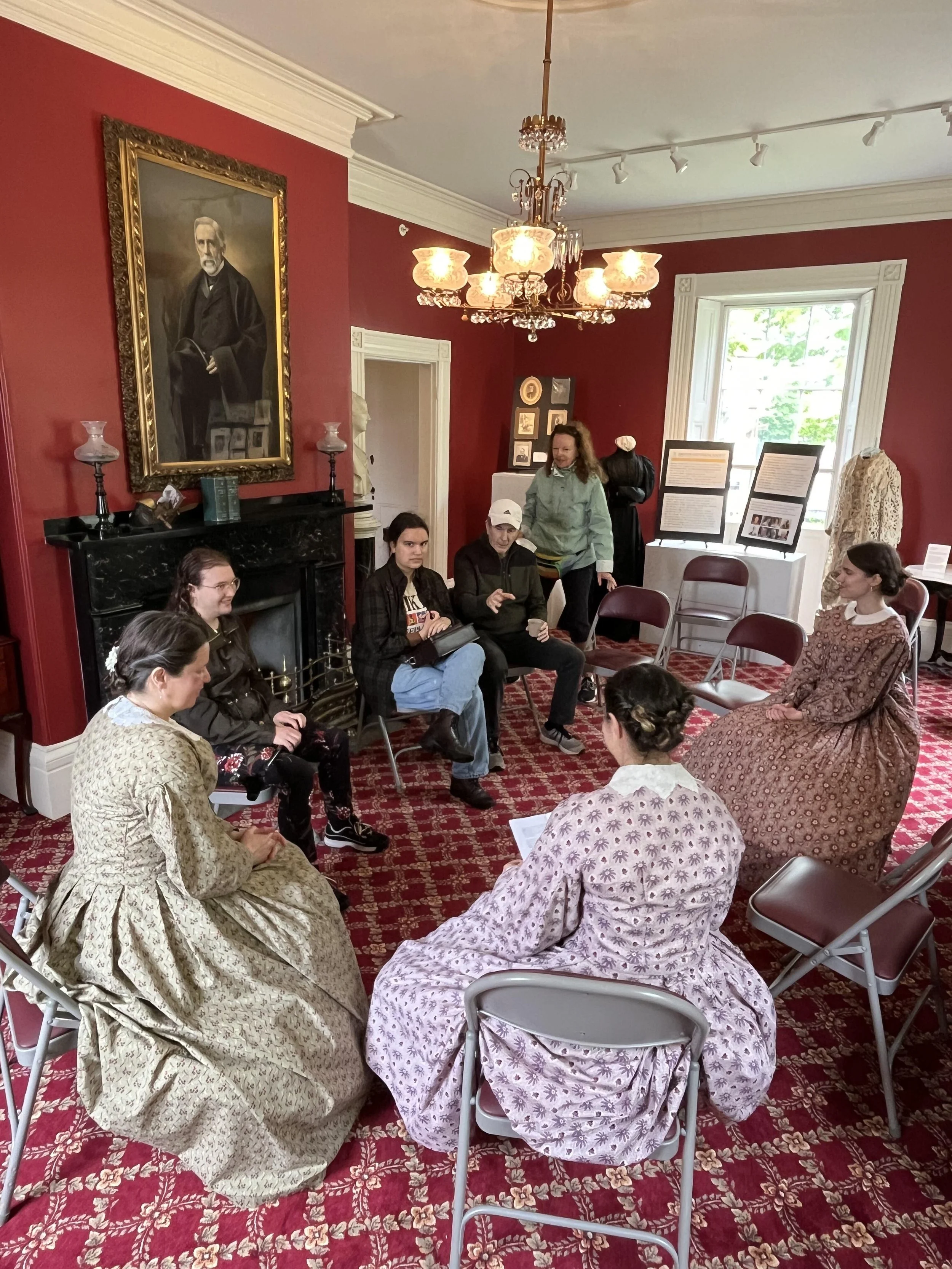 members of footwork & frolick lead victorian parlor games with members of the public visiting boutwell house