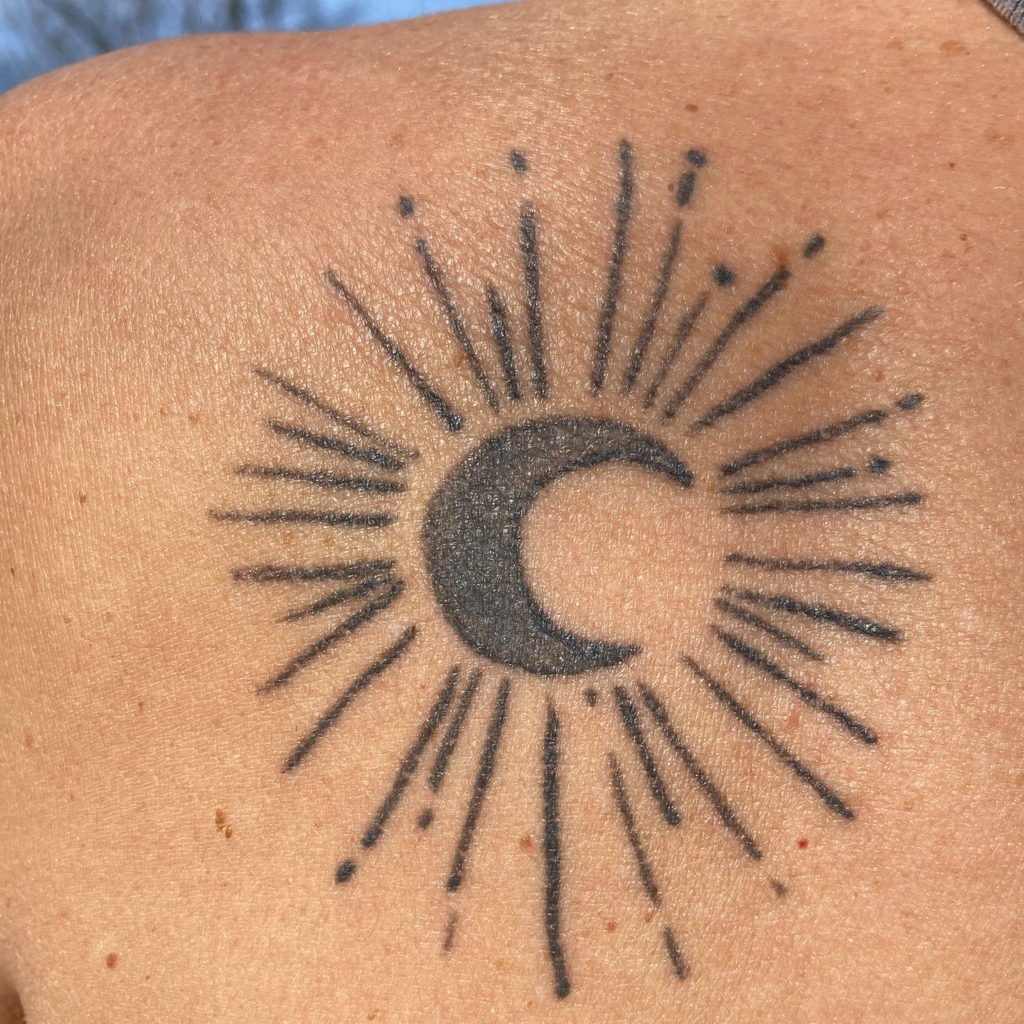 While the full totality wasn't in view near me, I enjoyed walking around Walden Pond with my love during the gently darkening eclipse. 

A few years ago when I turned 50, I gifted to myself this tattoo. This was what I wrote about it at the time: &qu