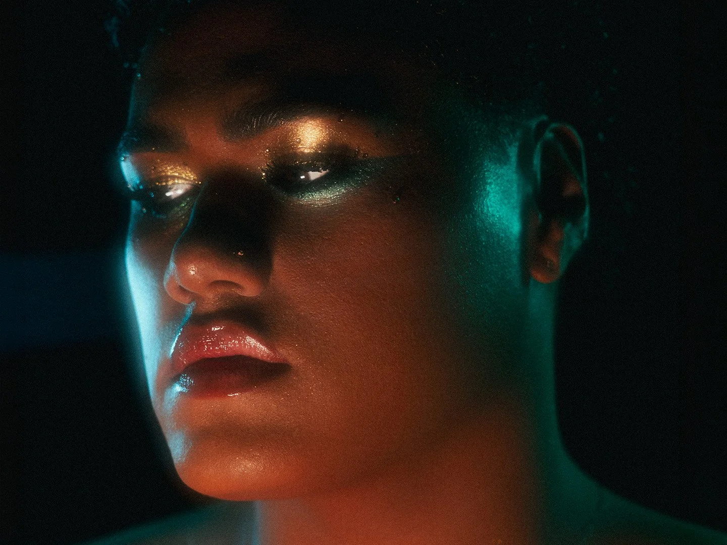 Kylee De Thier in a teal and gold makeup look for Beyonce All Night