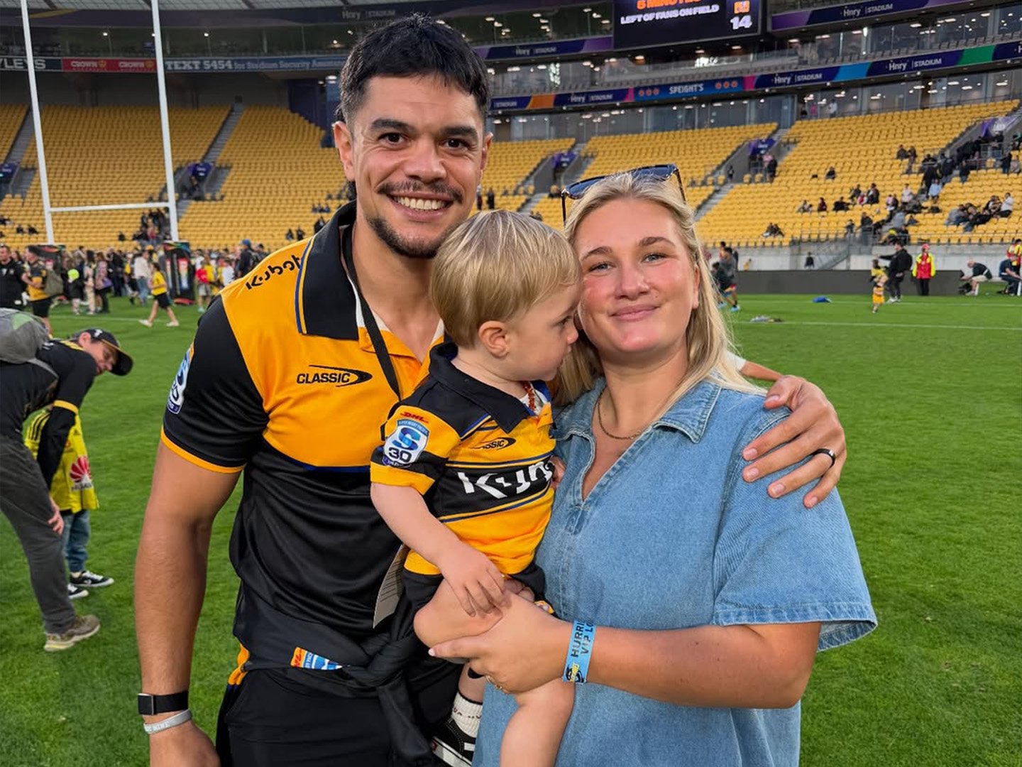 Eve and Ngane Punivai with their son Micah at a rugby game