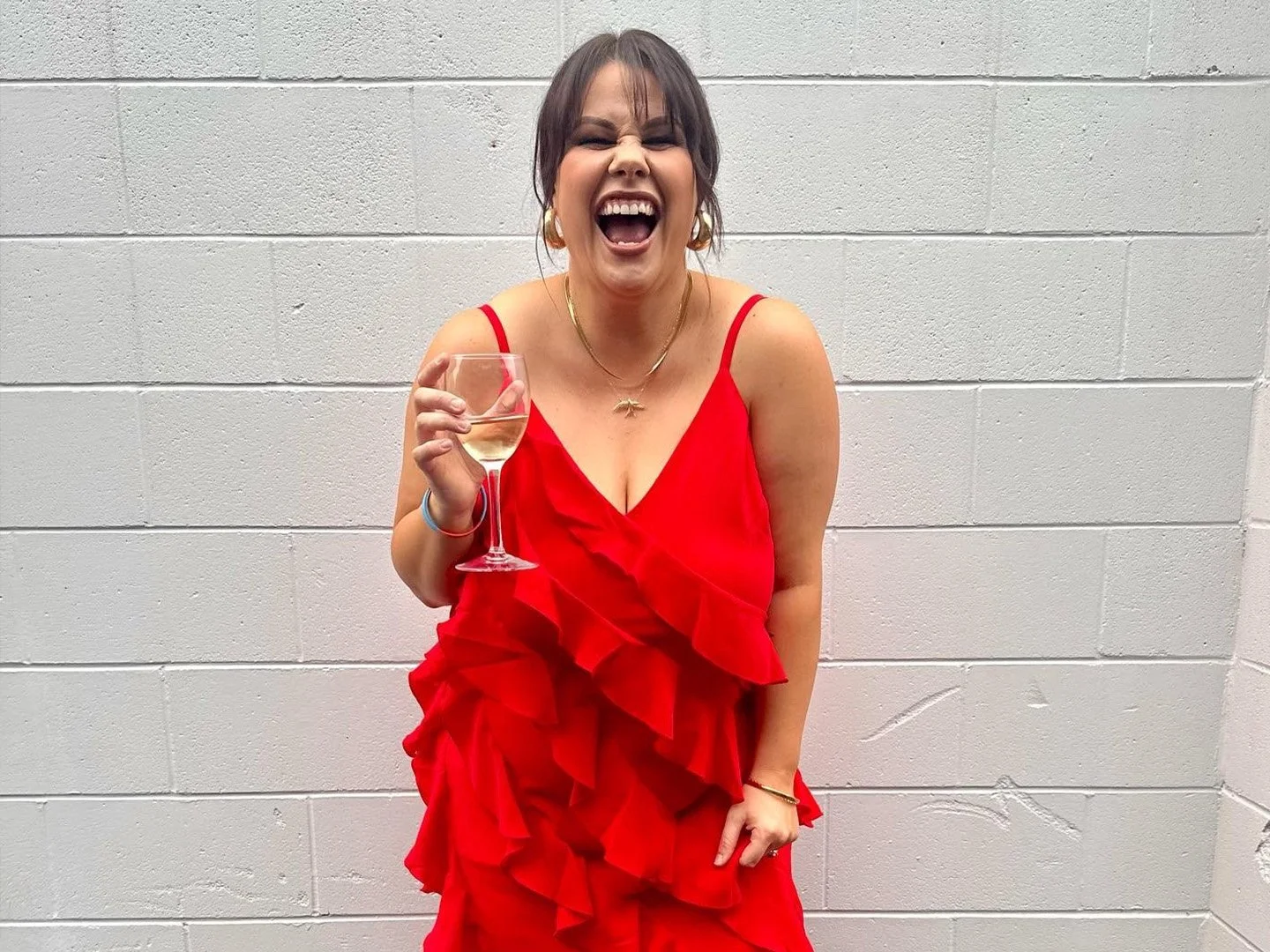 Rebekah Jujnovich in a red dress