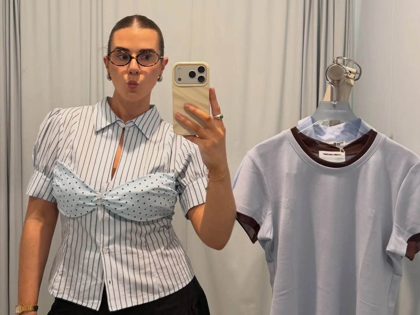Molly Cochrane taking a mirror fashion selfie